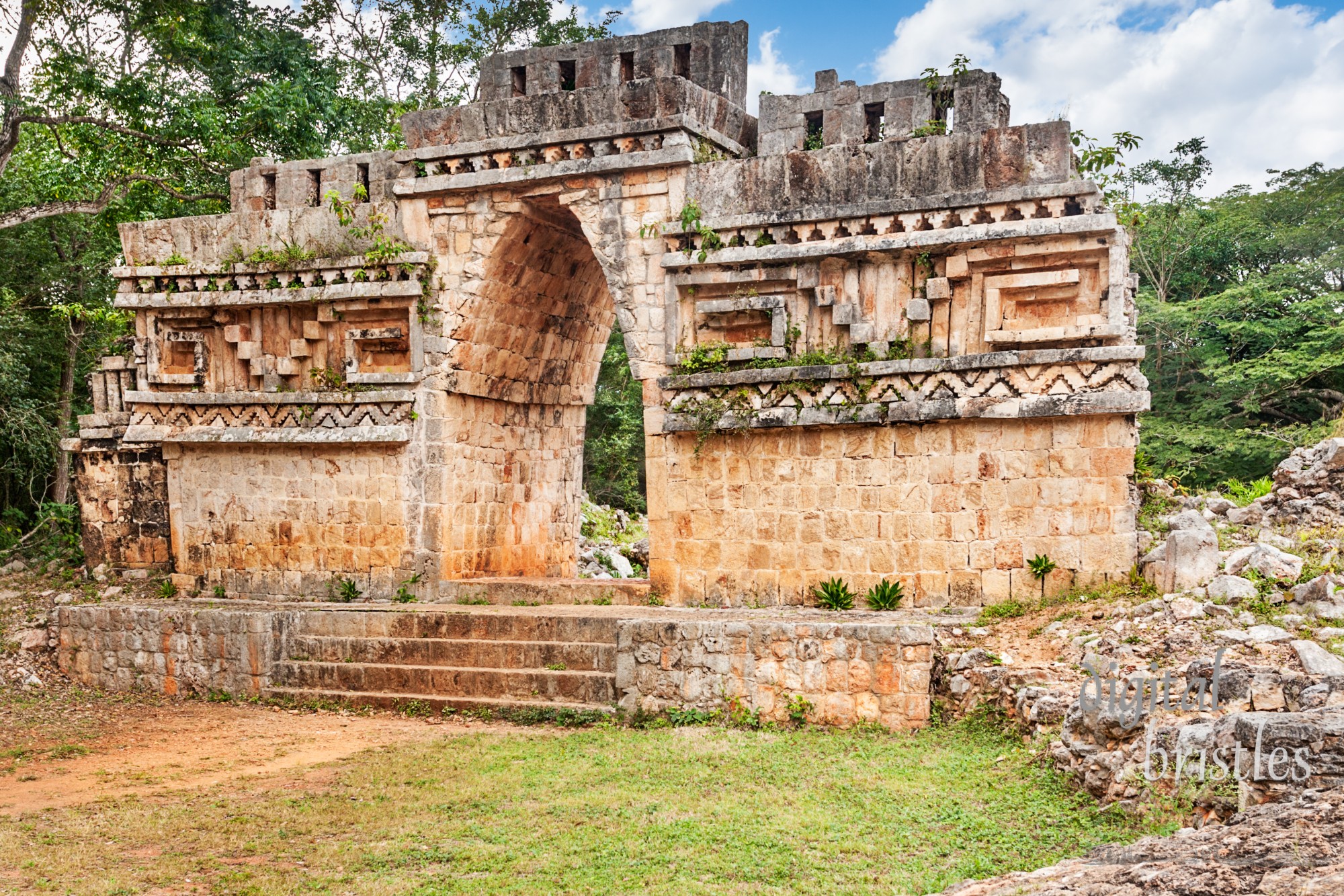 The overgrown outer face of Labna's Mayan vaulted arch