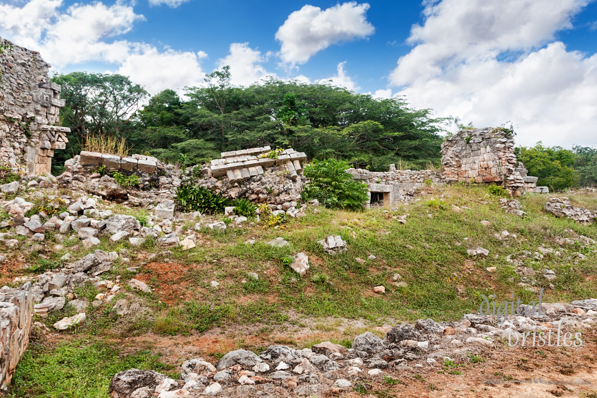 Collapsed structure beside vaulted arch, Labna, Mexico