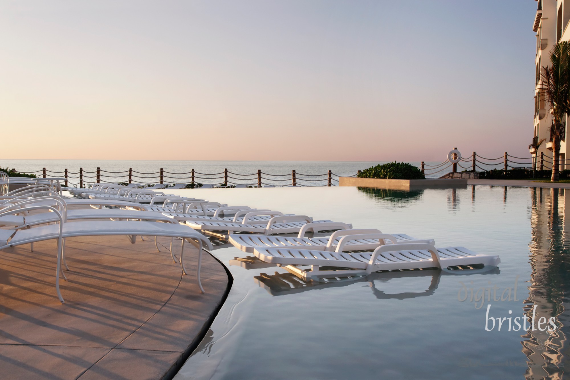 Sunrise at an oceanside pool, Cancun, Mexico