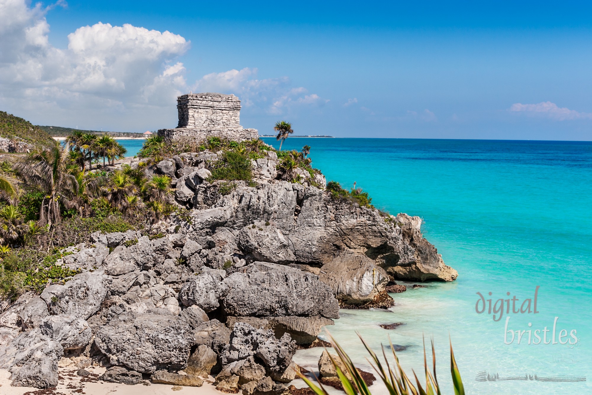 Mayan Temple of the Wind God, perched on a rocky cliff, Tulum, Mexico