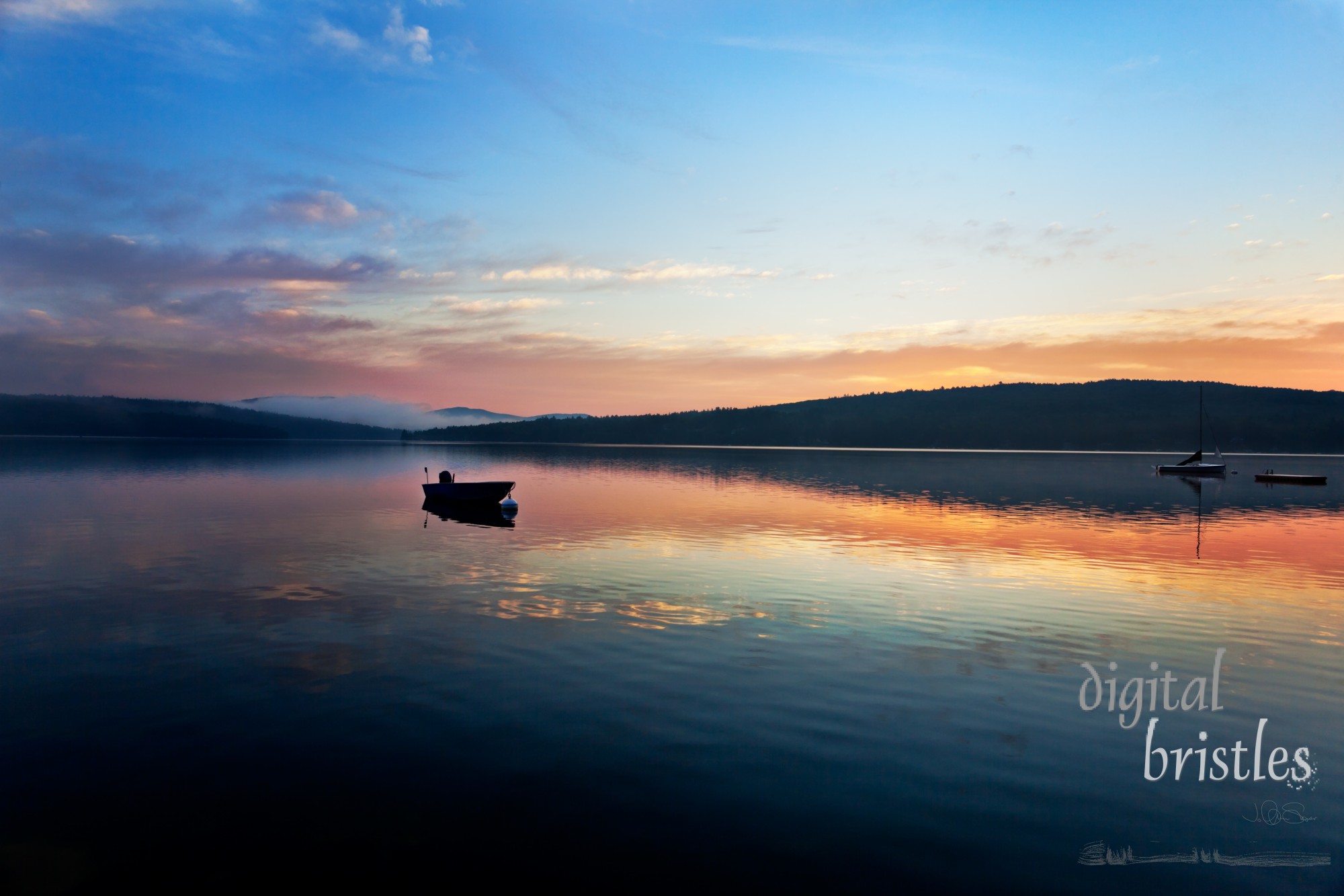 Small fishing boat anchored in lake silhouetted at summer sunrise