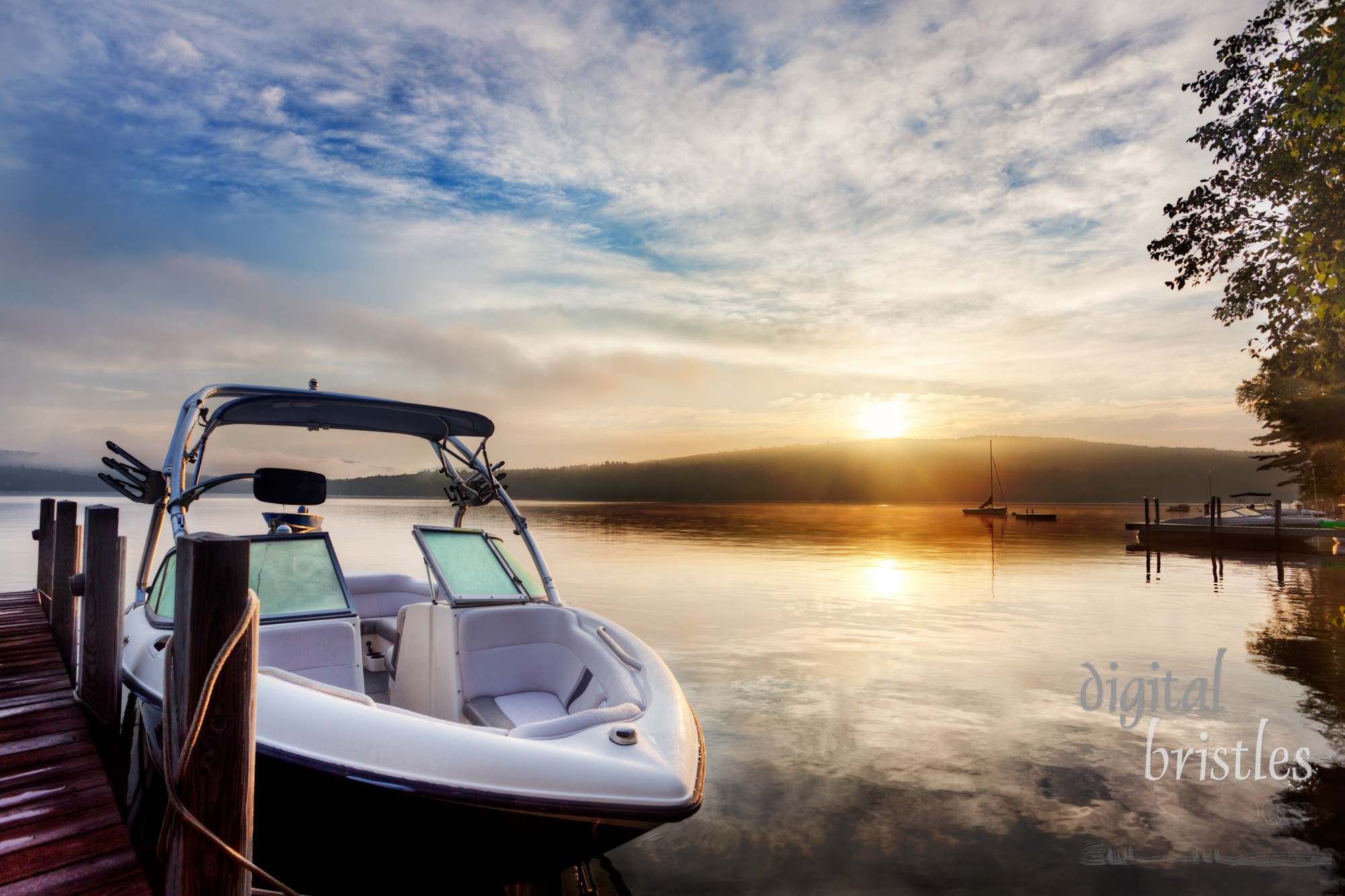 Sun and mist on a Summer New Hampshire boat dock at sunrise