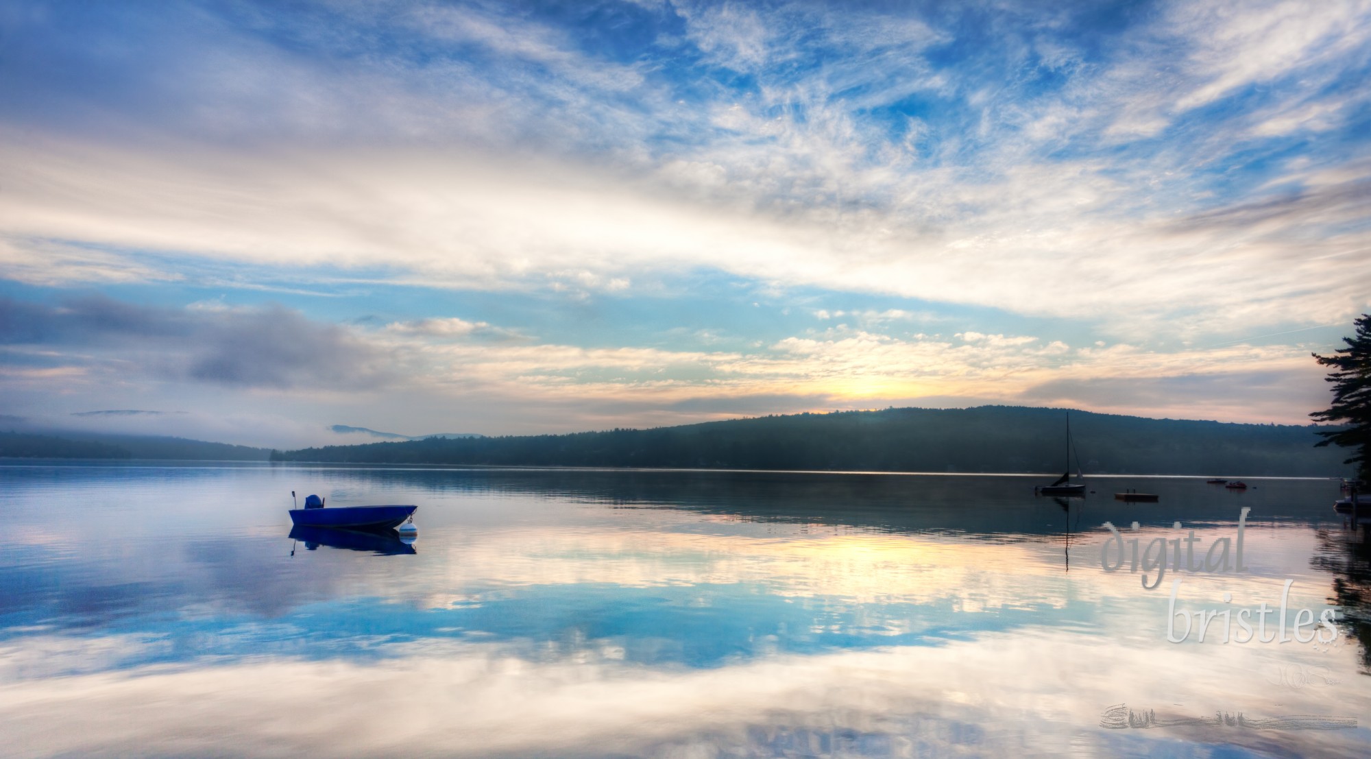 Clouds reflected in the calm dawn lake