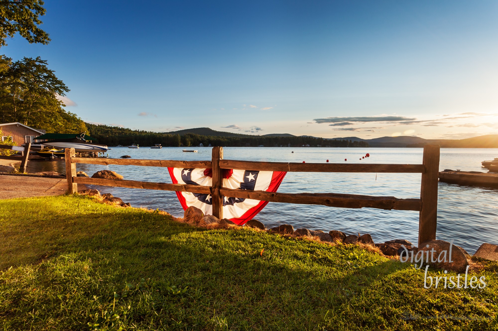 Colorful bunting lit by sunrise light on a summer morning at Merrymeeting Lake