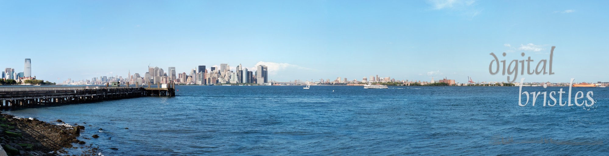 New York's financial district from Liberty Island framed by Ellis Island and the Staten Island ferry 