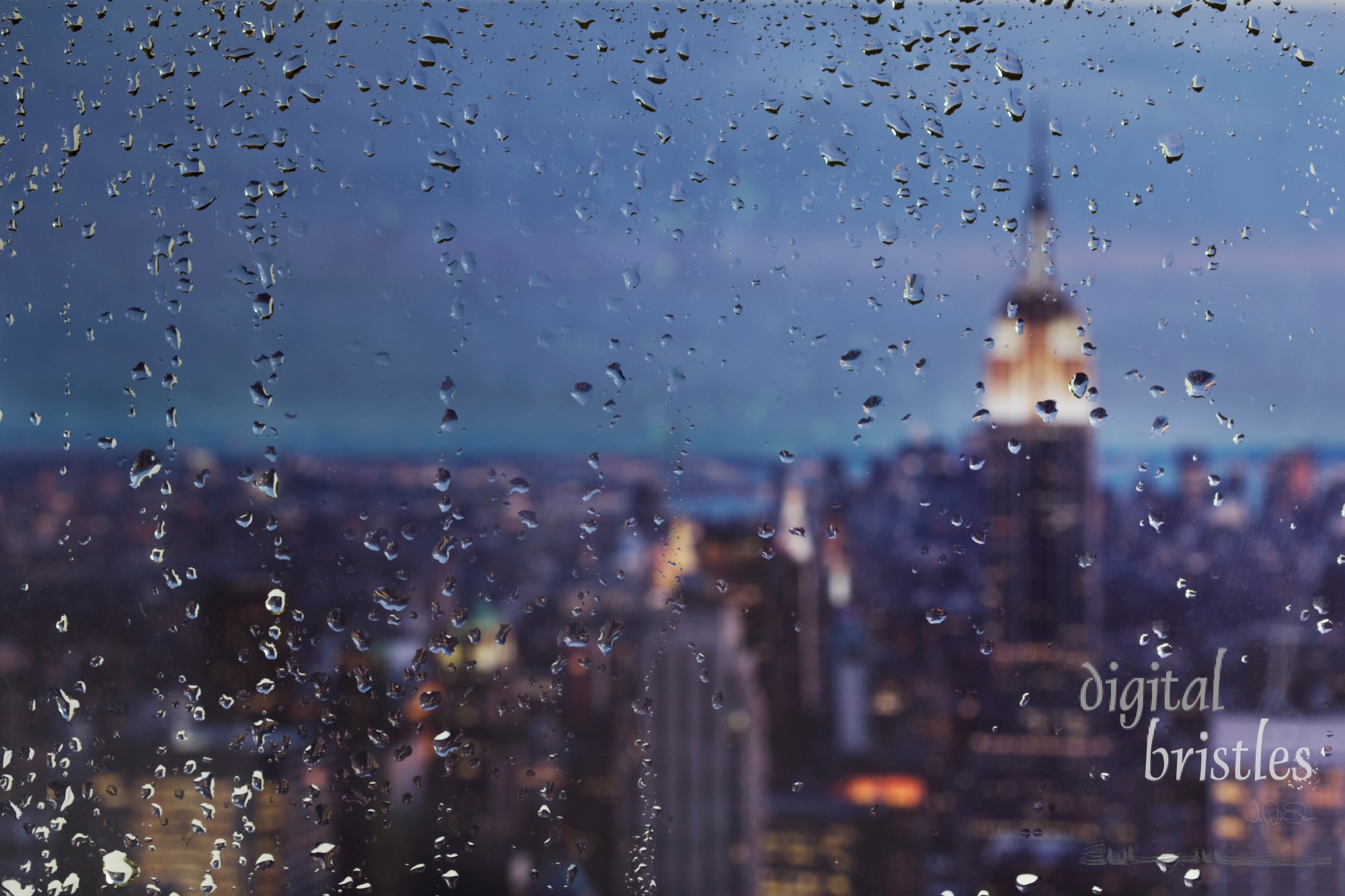 Raindrops on a window looking over New York City