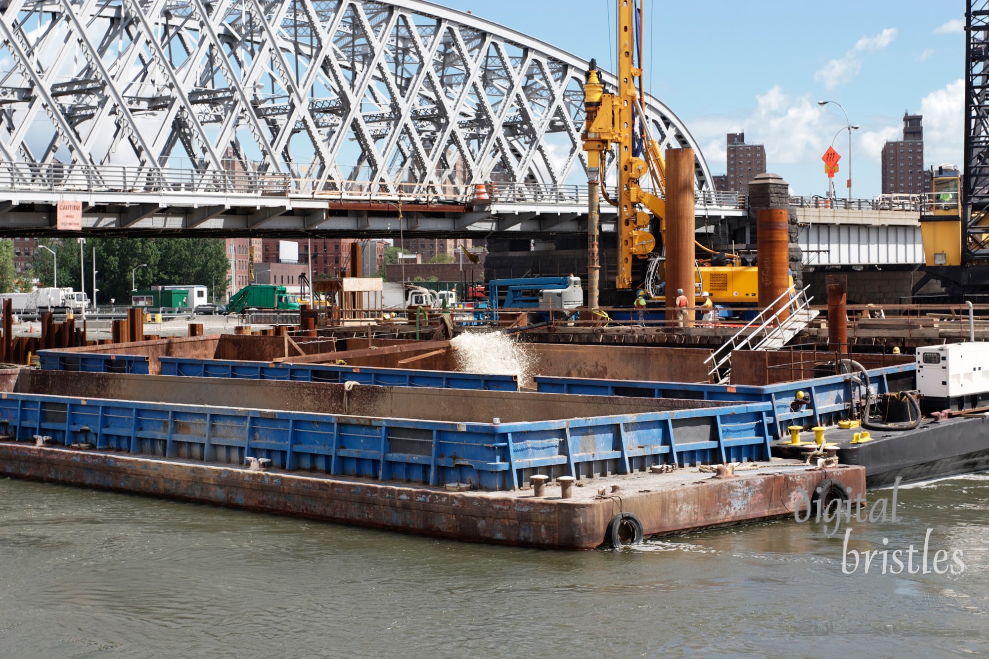 Construction work on the edge of the East River, New York