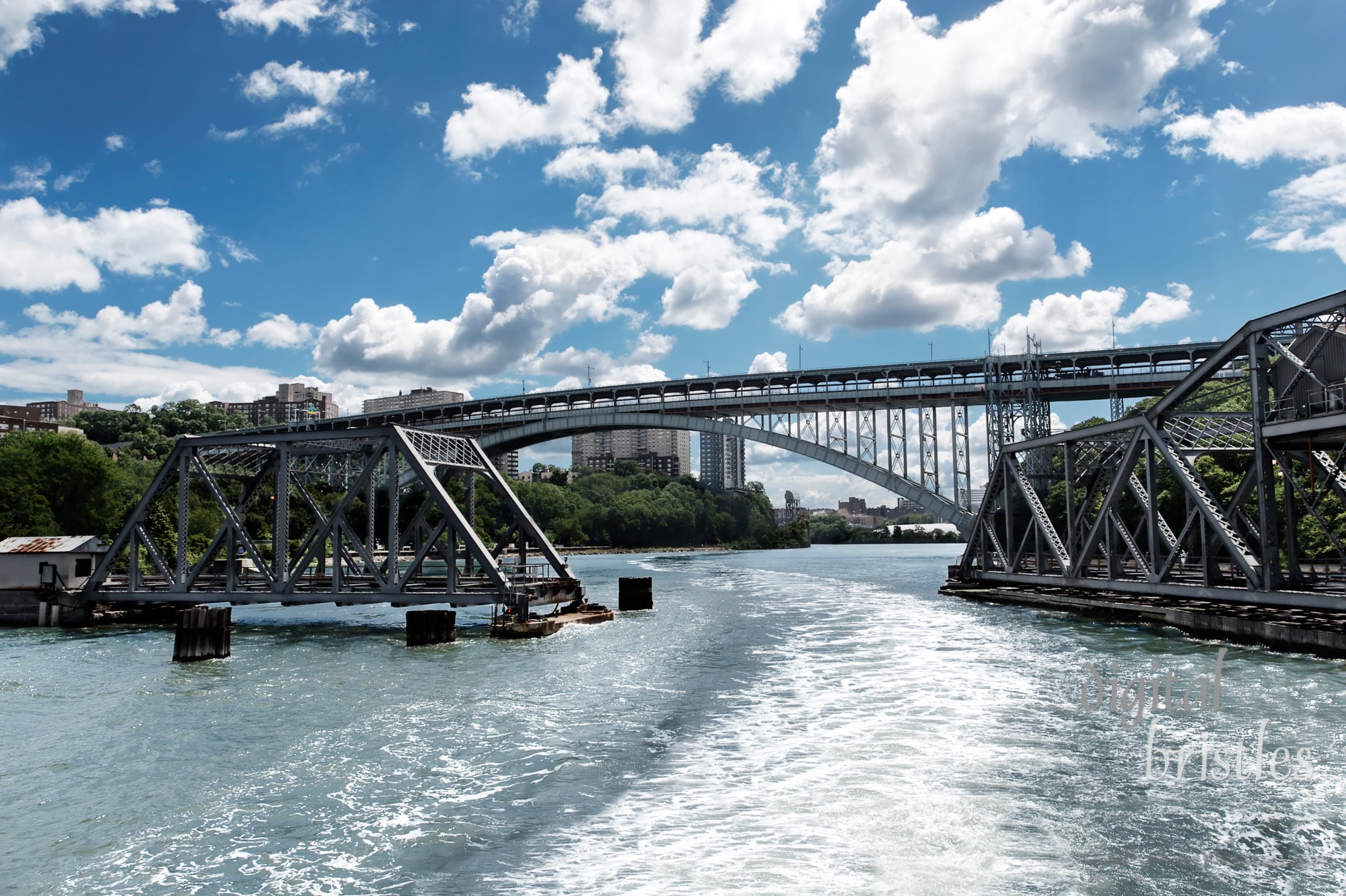 Swing bridge opening to let a boat pass through