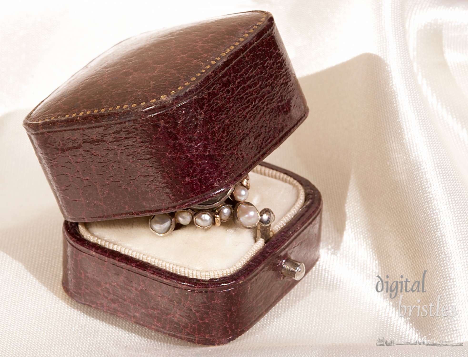 Antique leather jeweler's box, partially open