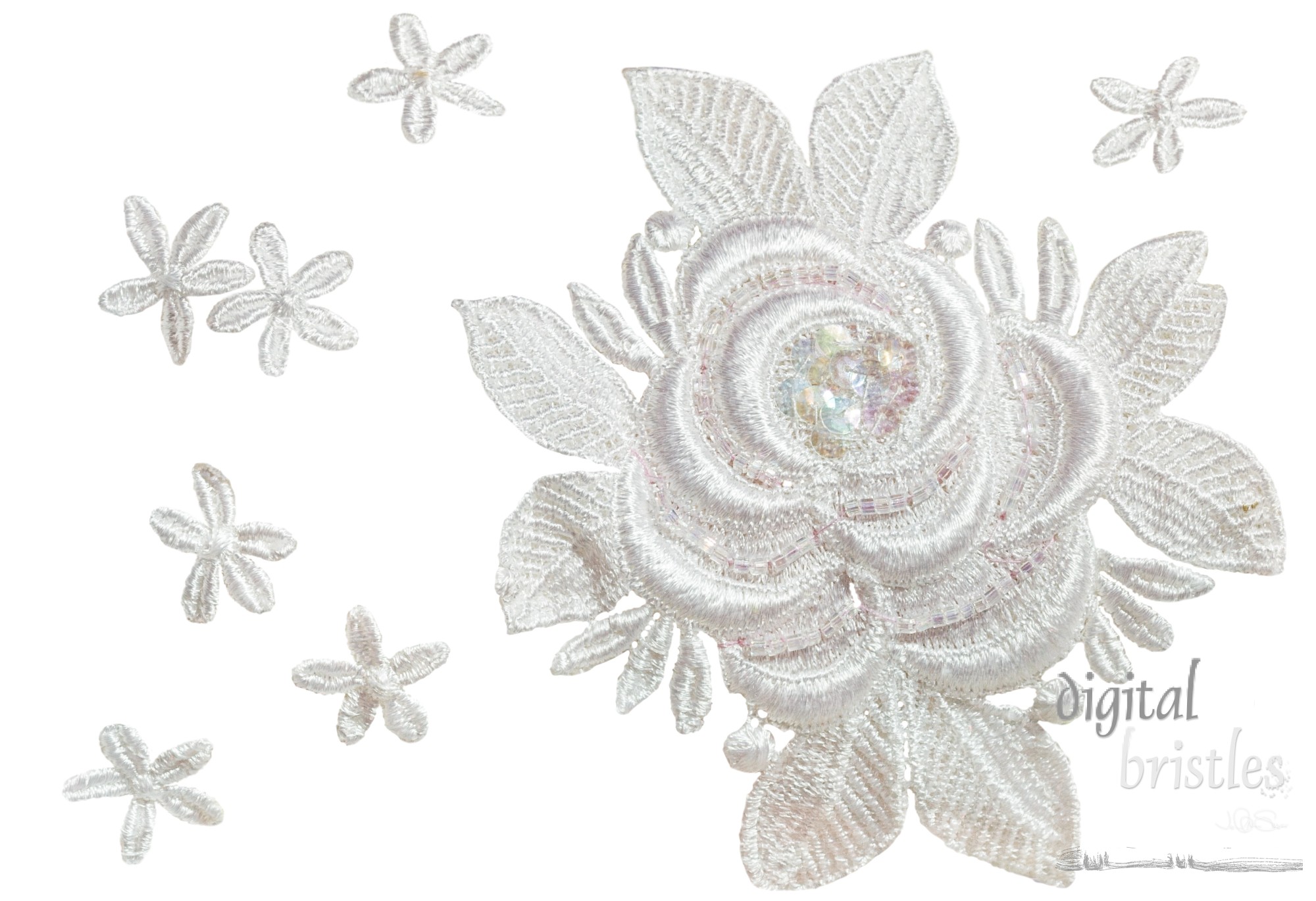 Close up of embroidered flowers and leaves on bridal fabric