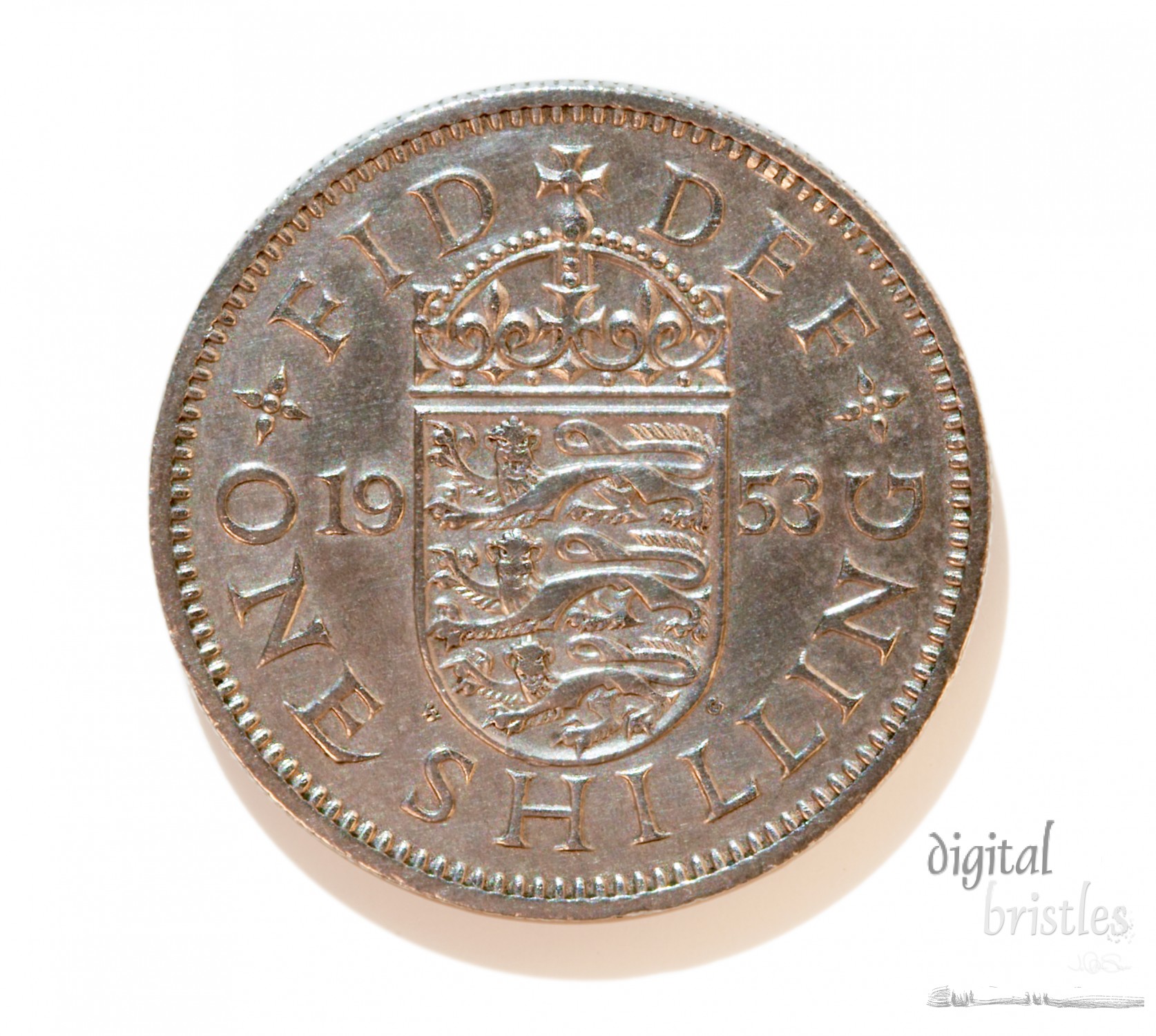 Shilling coin from the UK - English version with 3 lions couchant. With clipping path (excludes shadow)