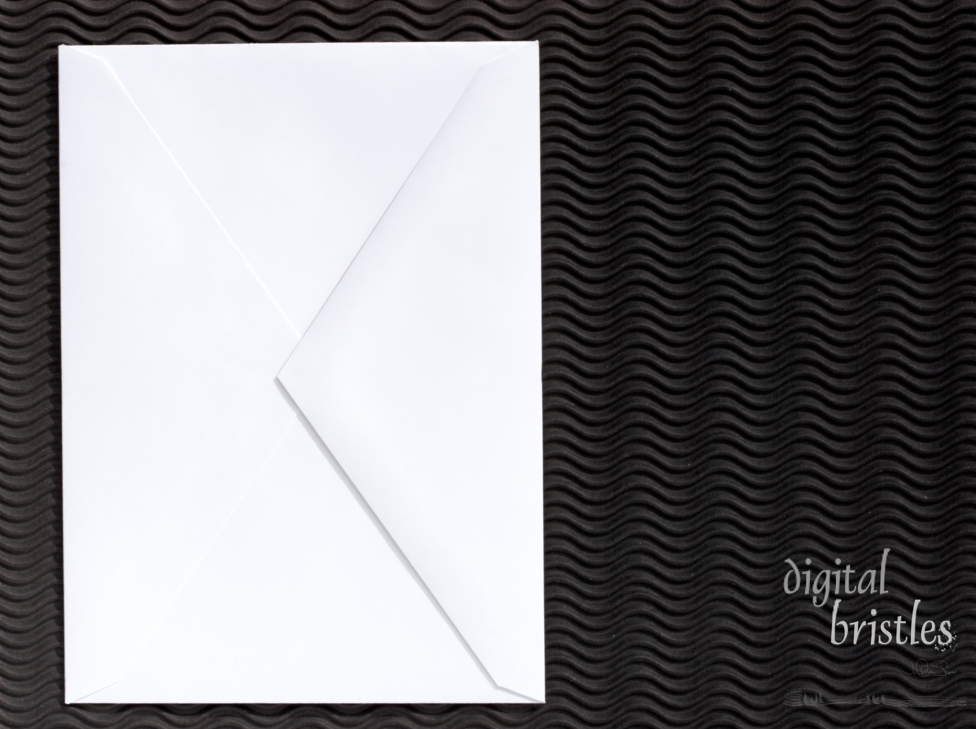 Closed white envelope on black background