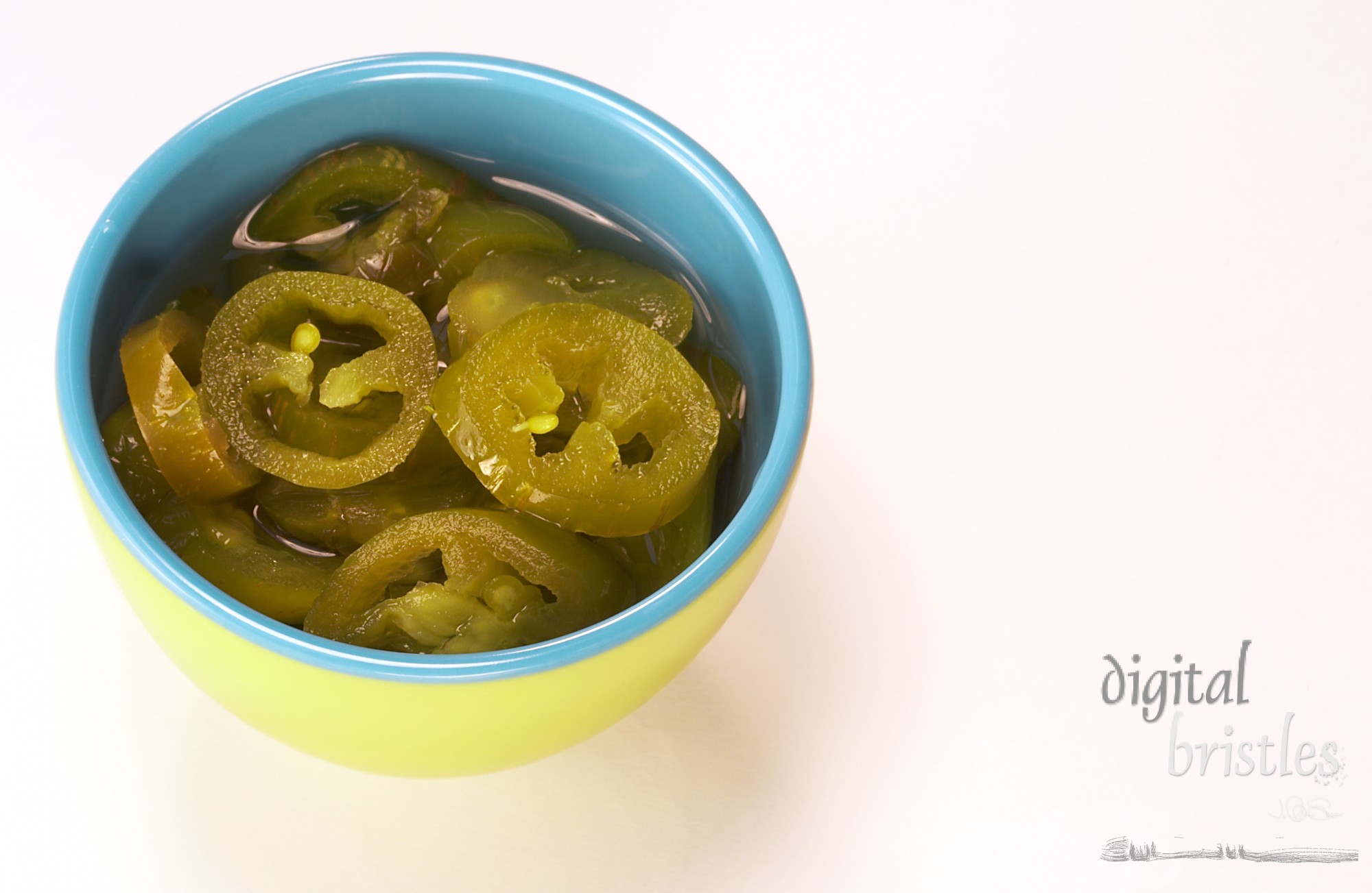 Cut jalapenos in small bowl