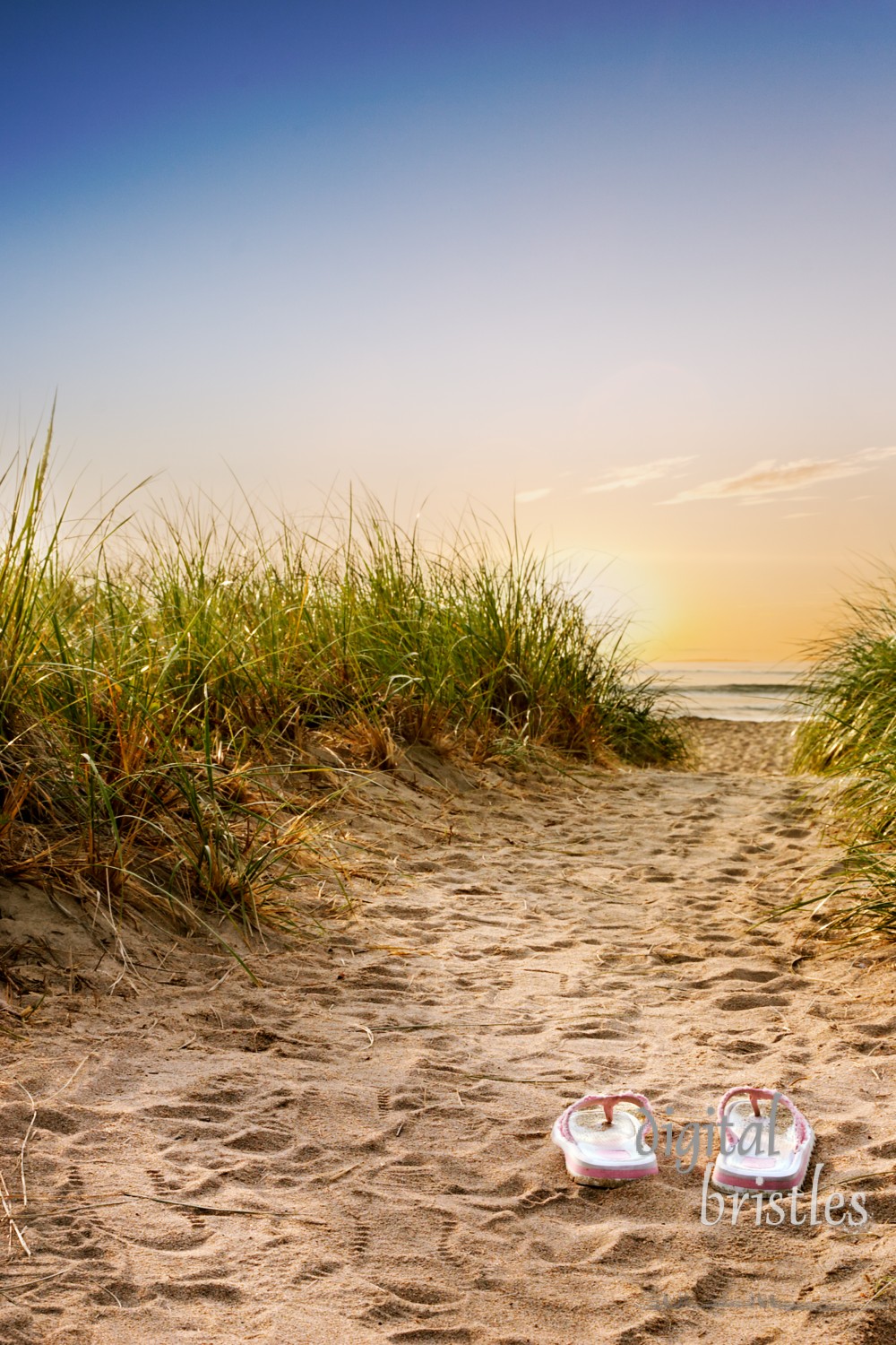 Flip flops on the sandy boardwalk over the dunes