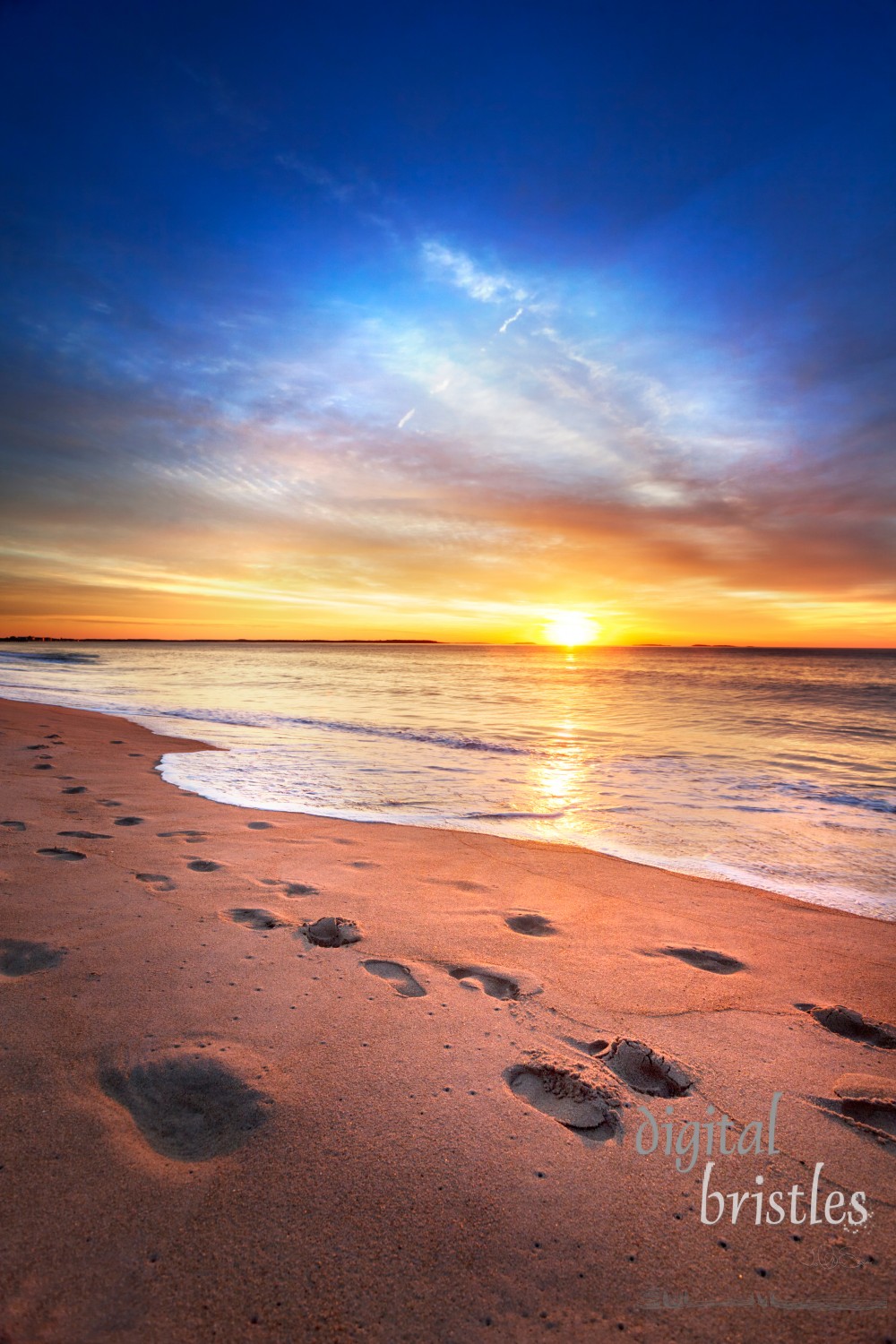 Maine beach as sun comes over the horizon