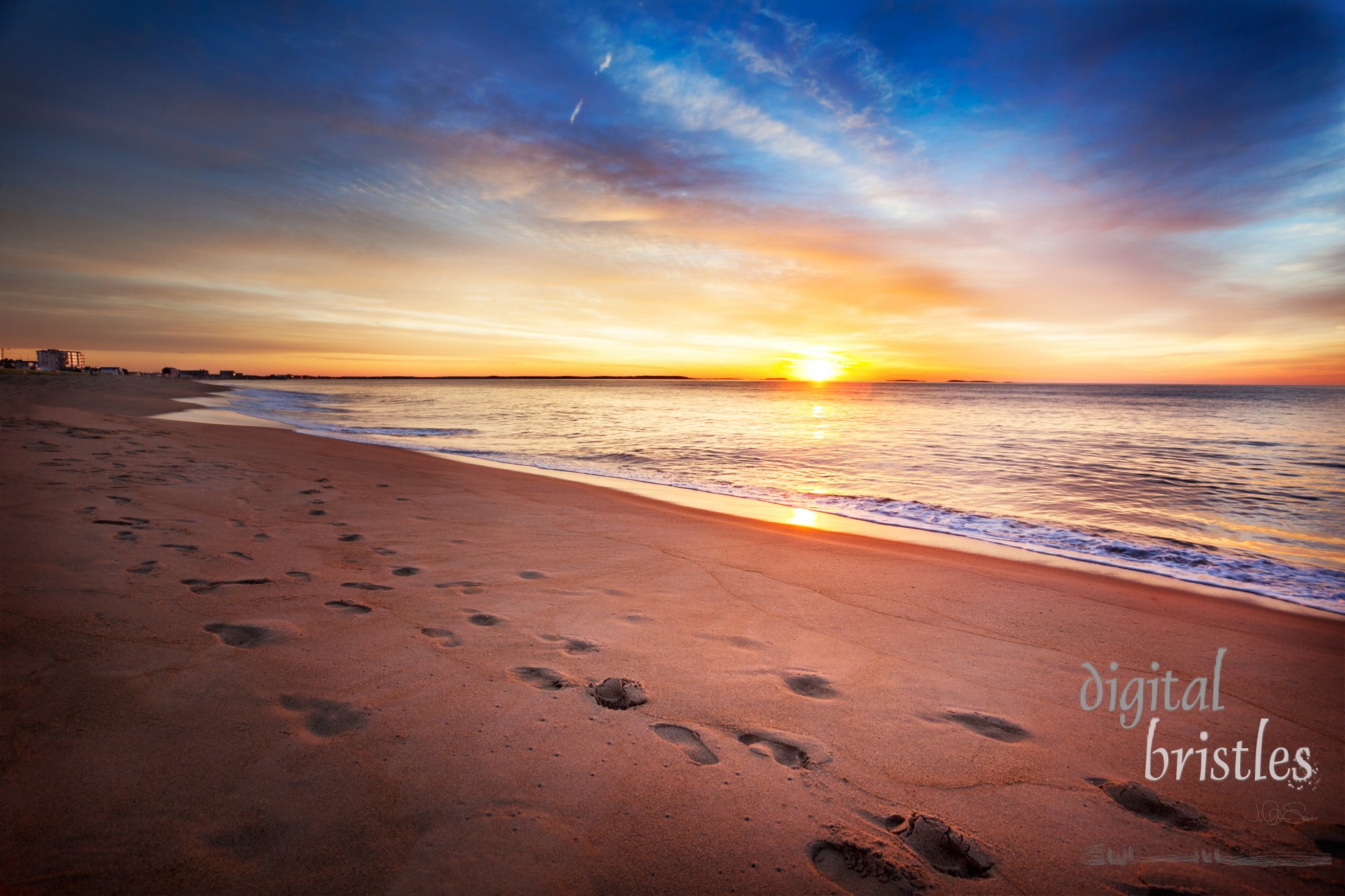 Maine beach as sun comes over the horizon