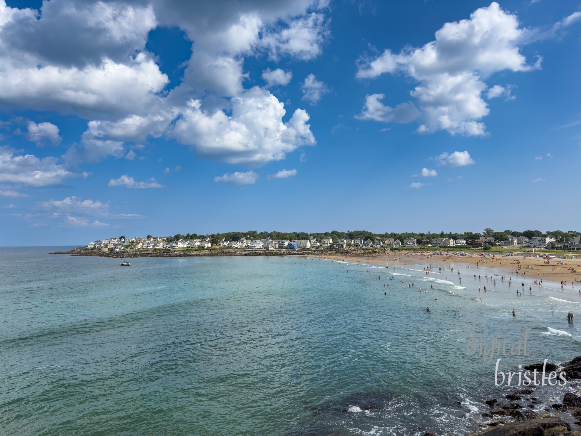 August vacationers enjoy a sunny Summer afternoon at York's Short Sands beach