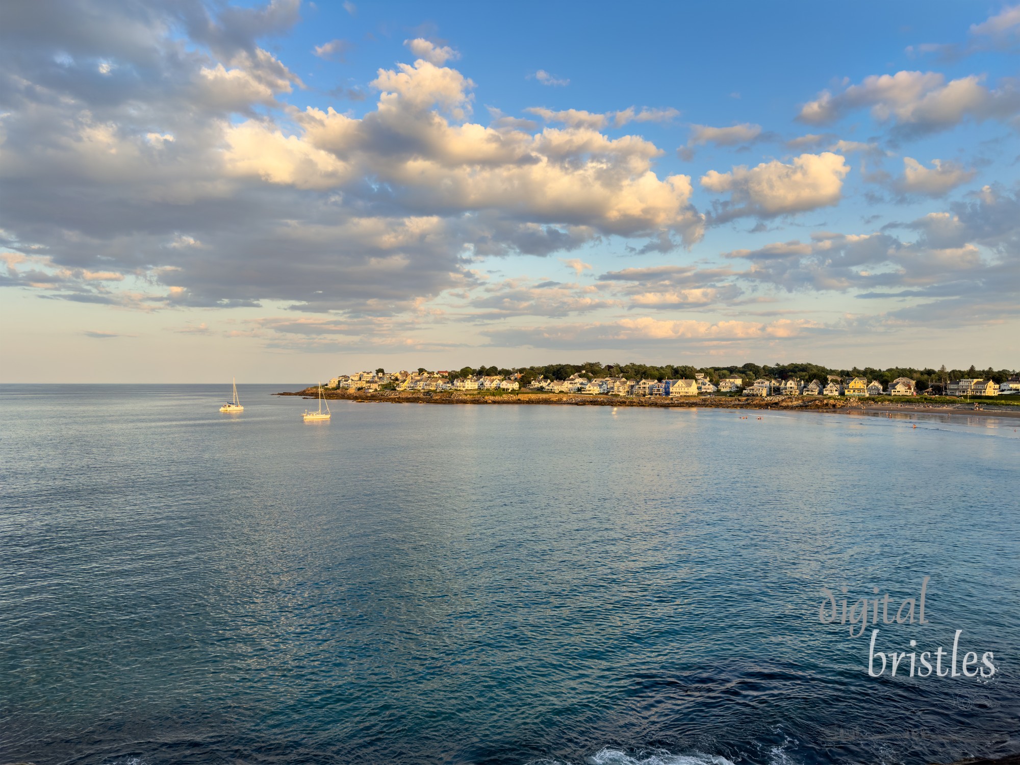 Boats anchored and sunset calm settles over Short Sands Beach, York, Maine