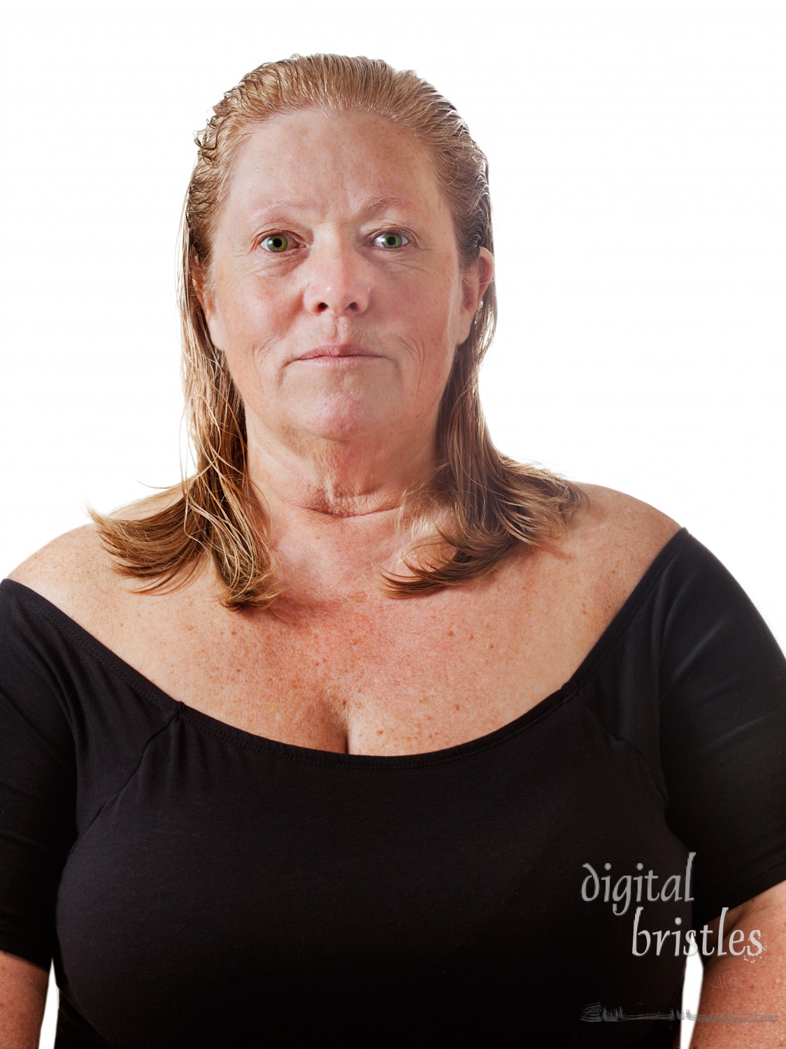 Mature woman with a completely makeup free face and wet hair