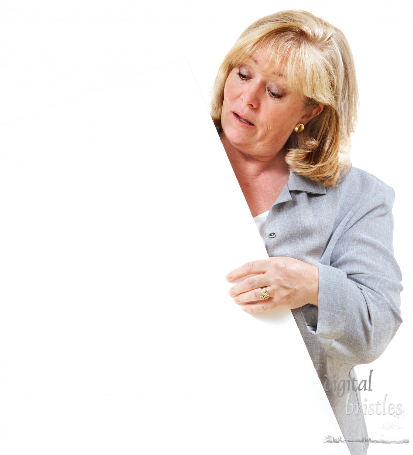 Mature woman looking at the sign she's holding