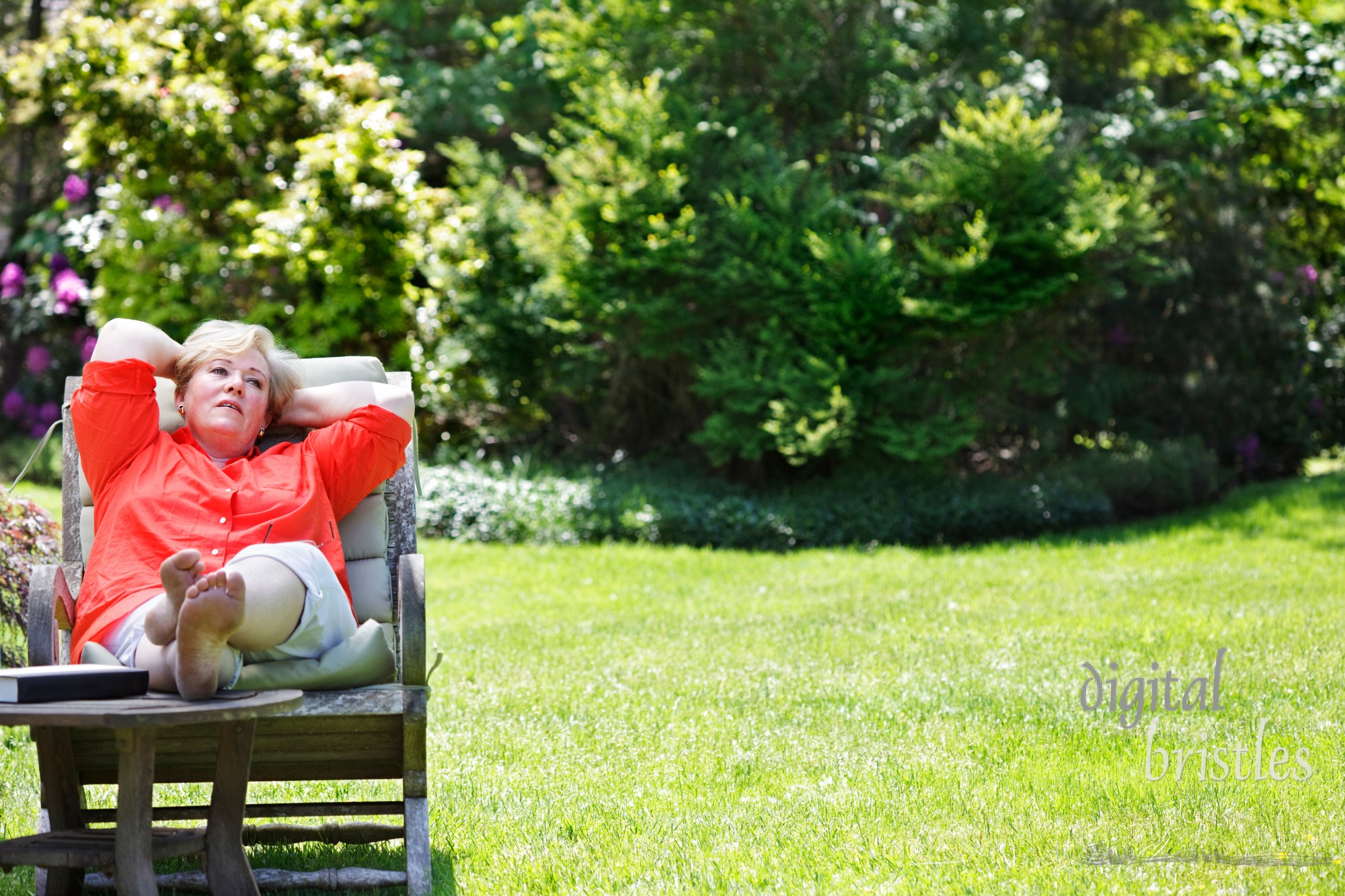 Mature woman sitting & thinking outside