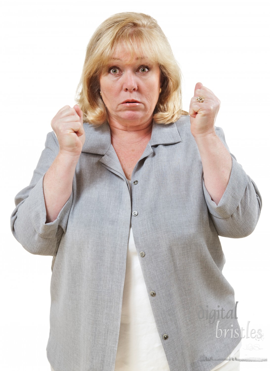 Angry mature woman, fists clenched and eyes bulging