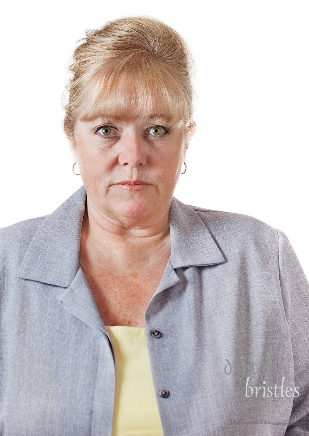 Late 50s woman with hair up, comfortable looking her age