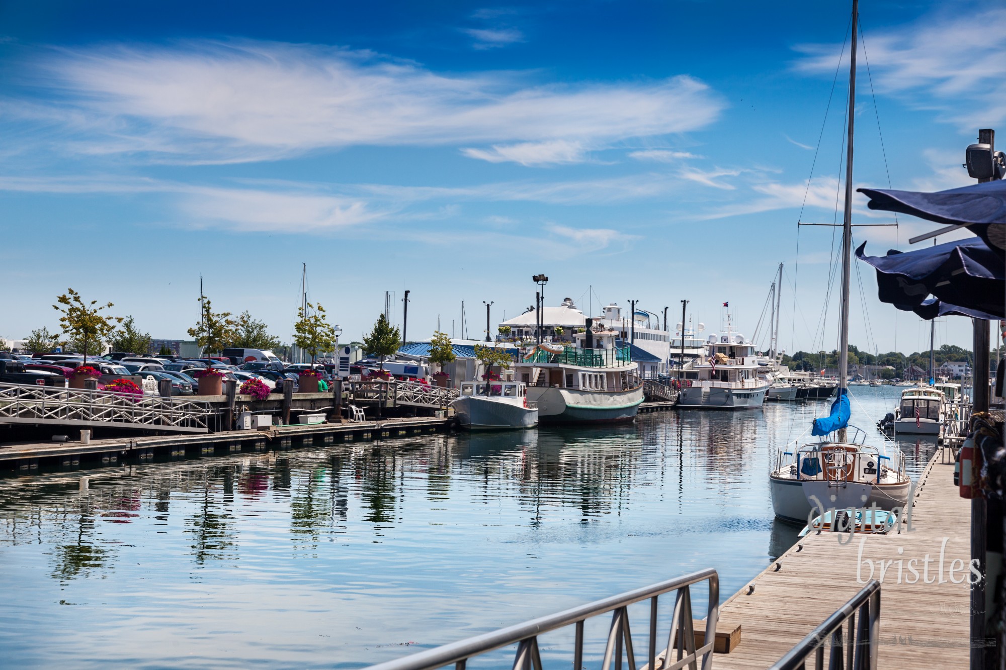 Summer lunchtime on Chandler's Wharf, looking over to Long Wharf, Portland, Maine