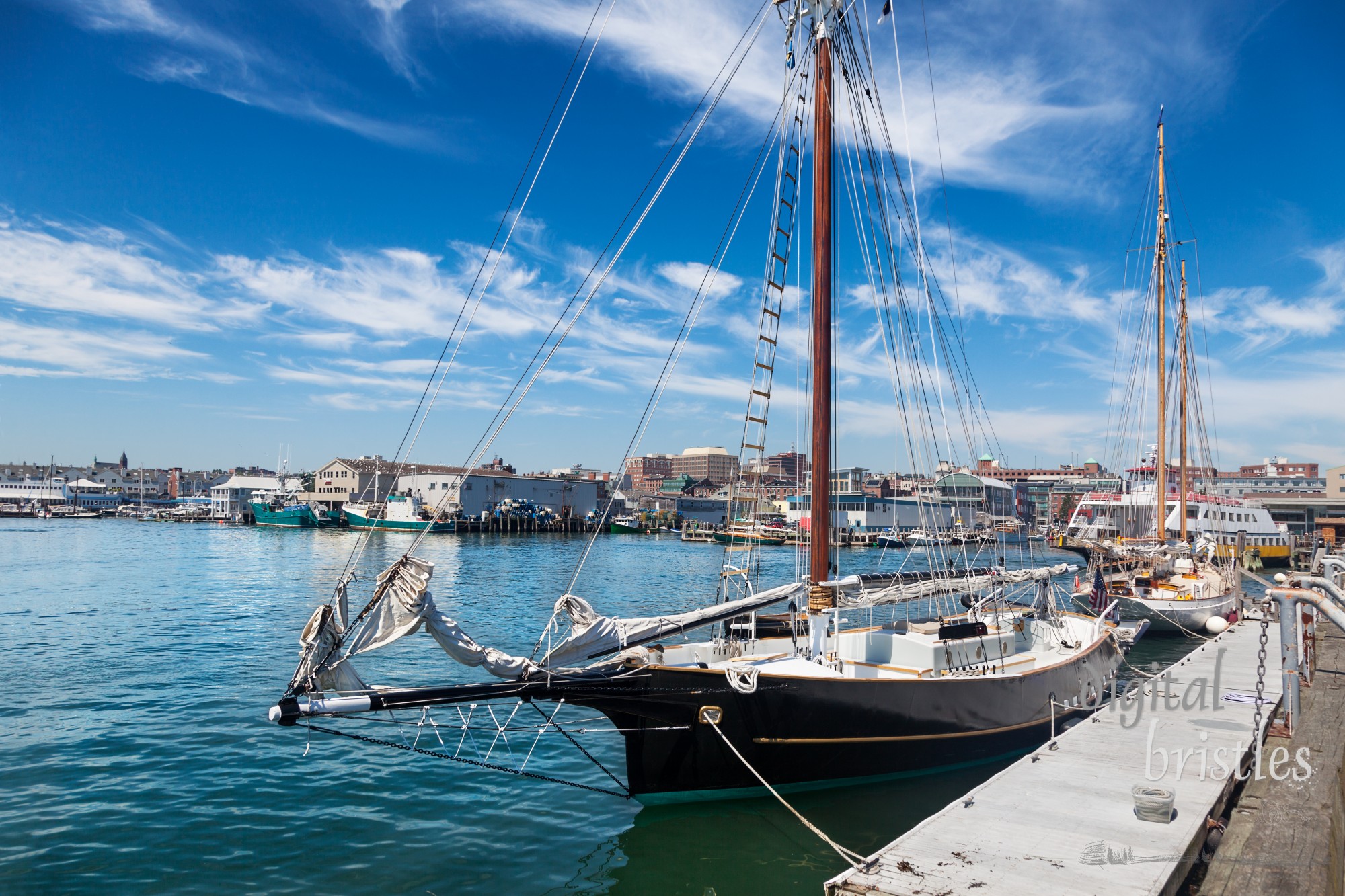 Portland, Maine, busy working waterfront with many boats, wharves and fishing businesses