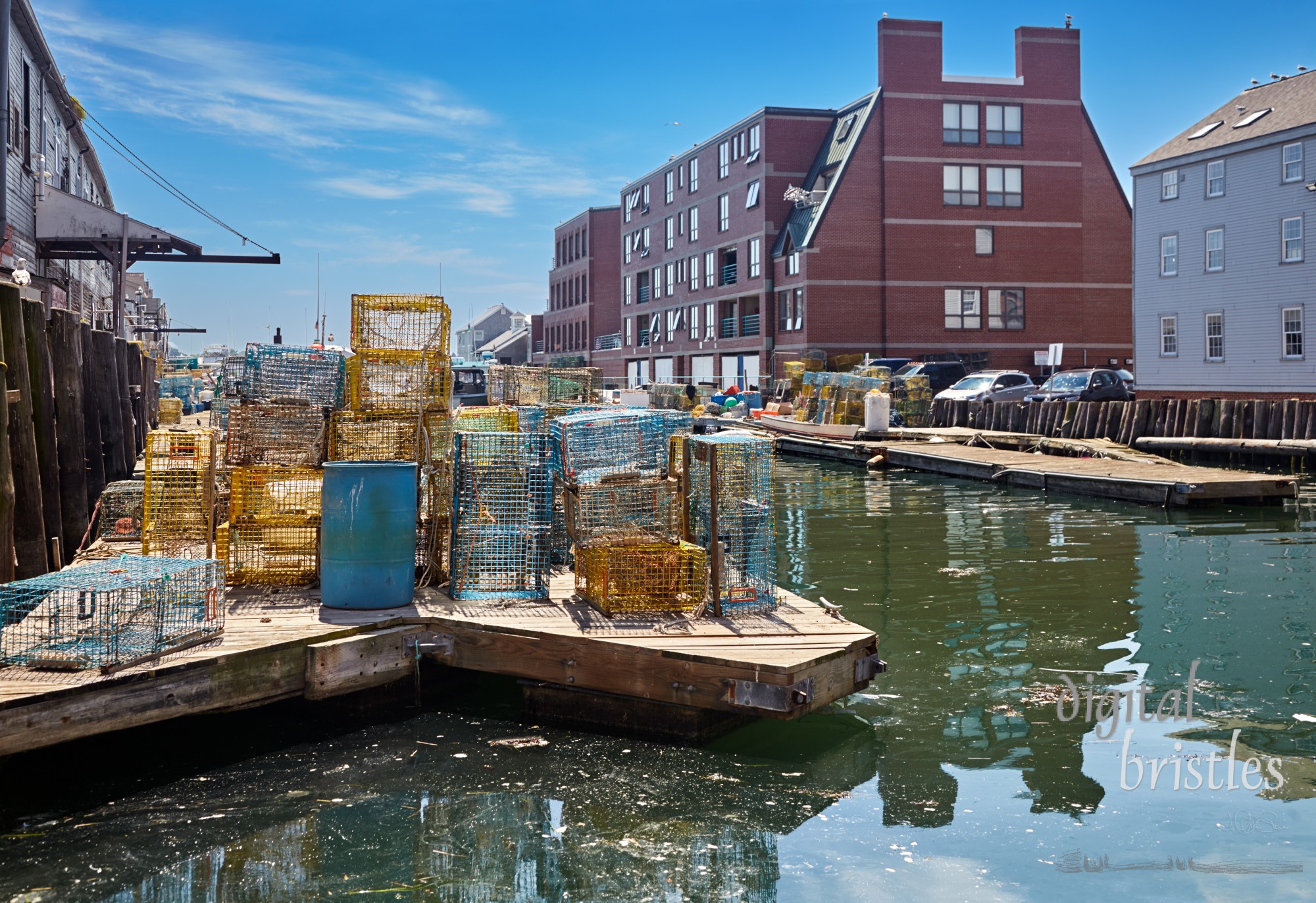 Lobster traps behind  Custom House Wharf, and opposite on  Portland Pier, Old Port, Portland, Maine