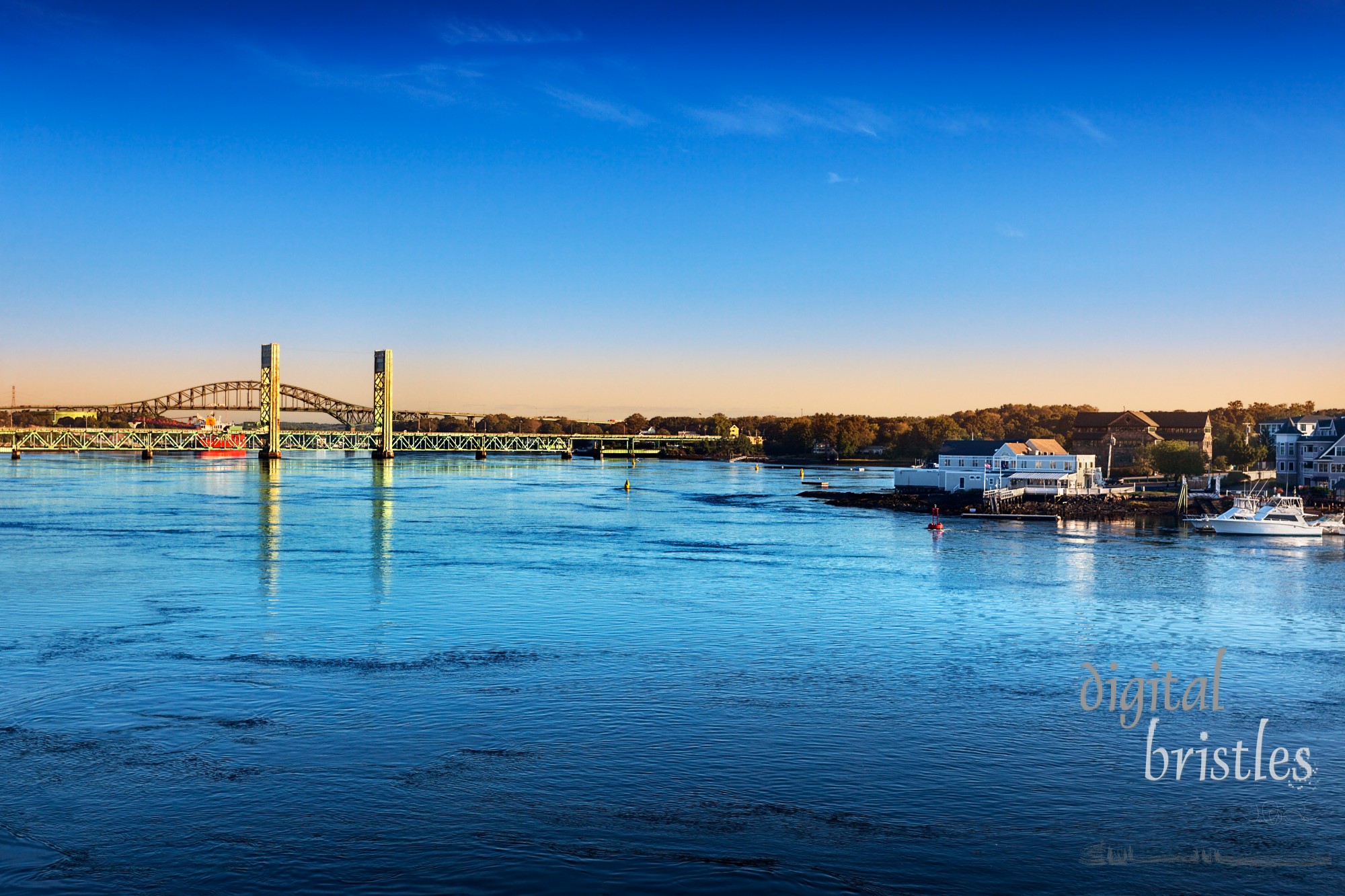 Morning sun hits the Piscataqua River and Sarah M. Long Bridges, connecting Portsmouth, New Hampshire and Maine