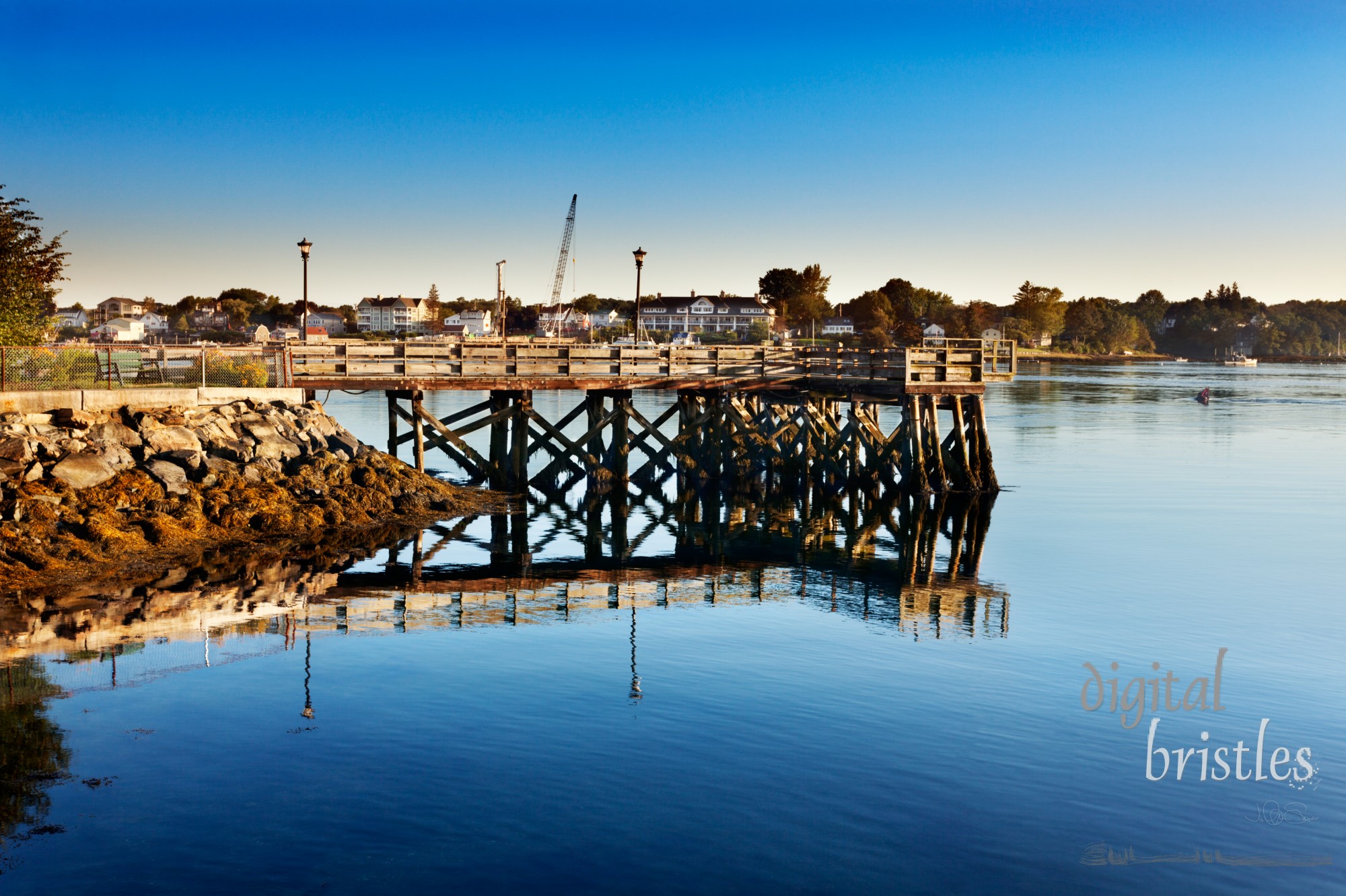 Wooden walkway juts into the swift Piscataqua River early on a summer morning, Portsmouth, New Hampshire