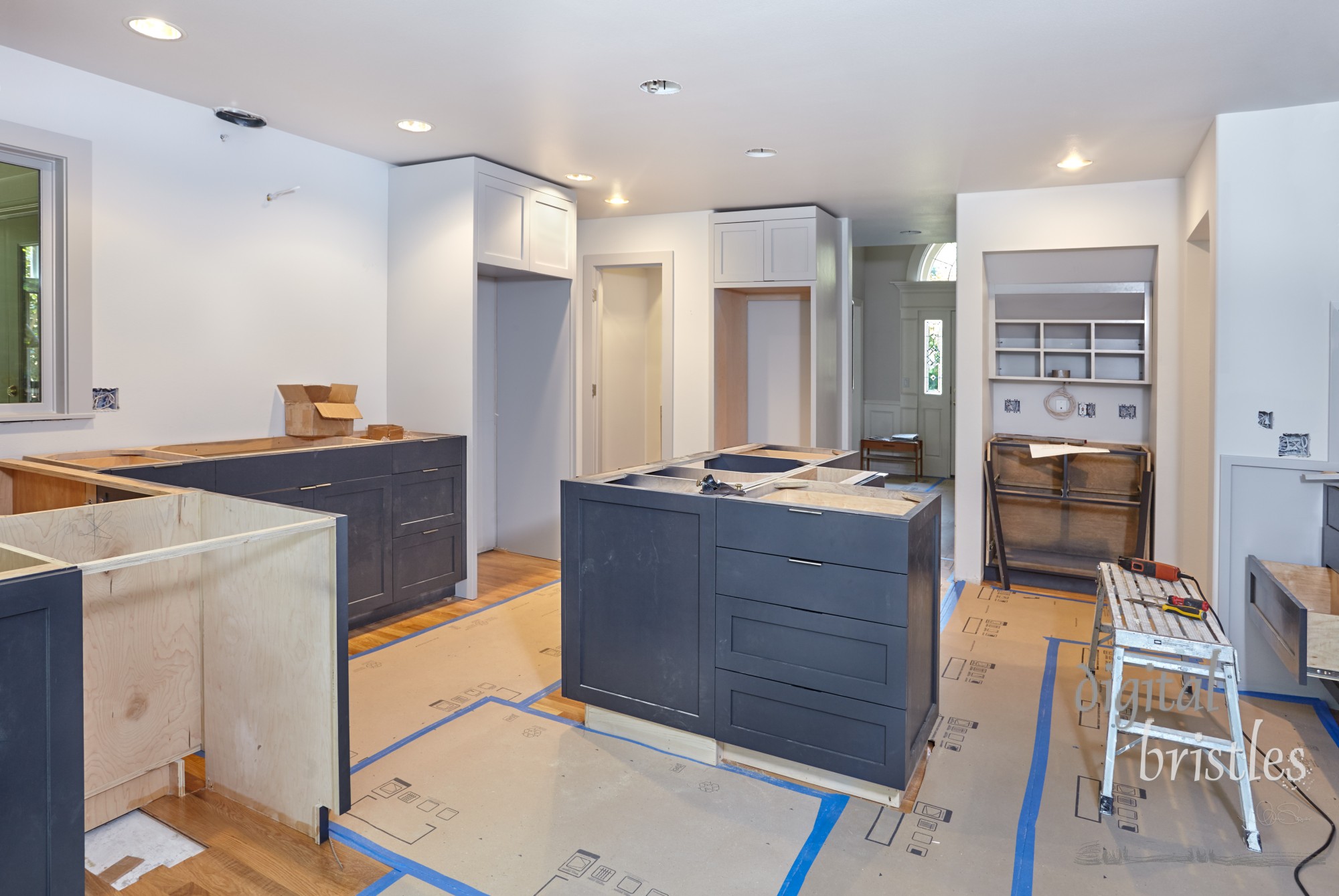 Custom cabinets for kitchen island, desk and counters are set in place