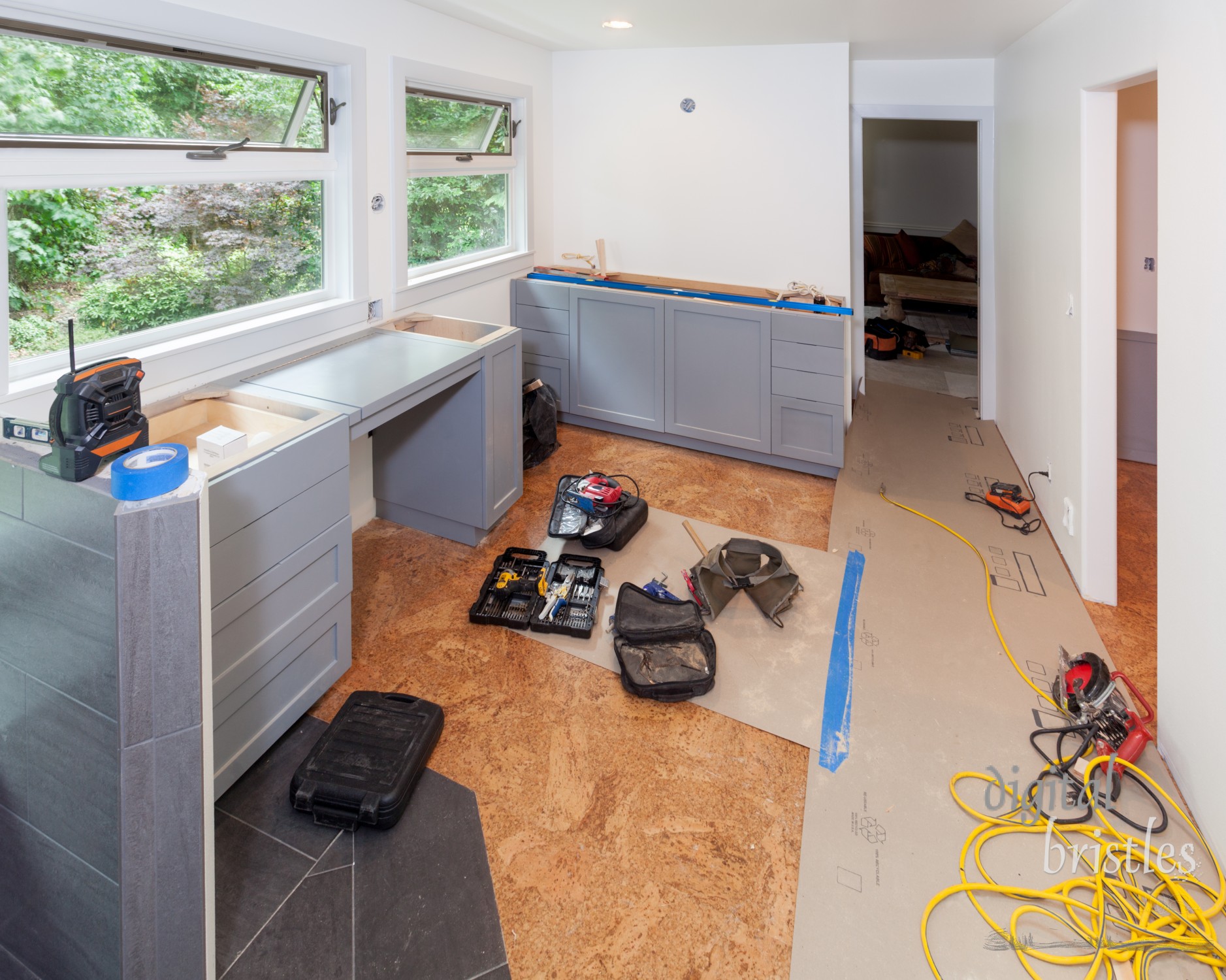 Tools left out during lunchbreak while installing custom cabinets in master bathroom