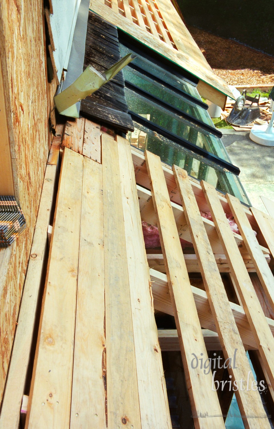 Remodeling - framing for new roof sections extending over deck and patio. Note scanned from 35mm film