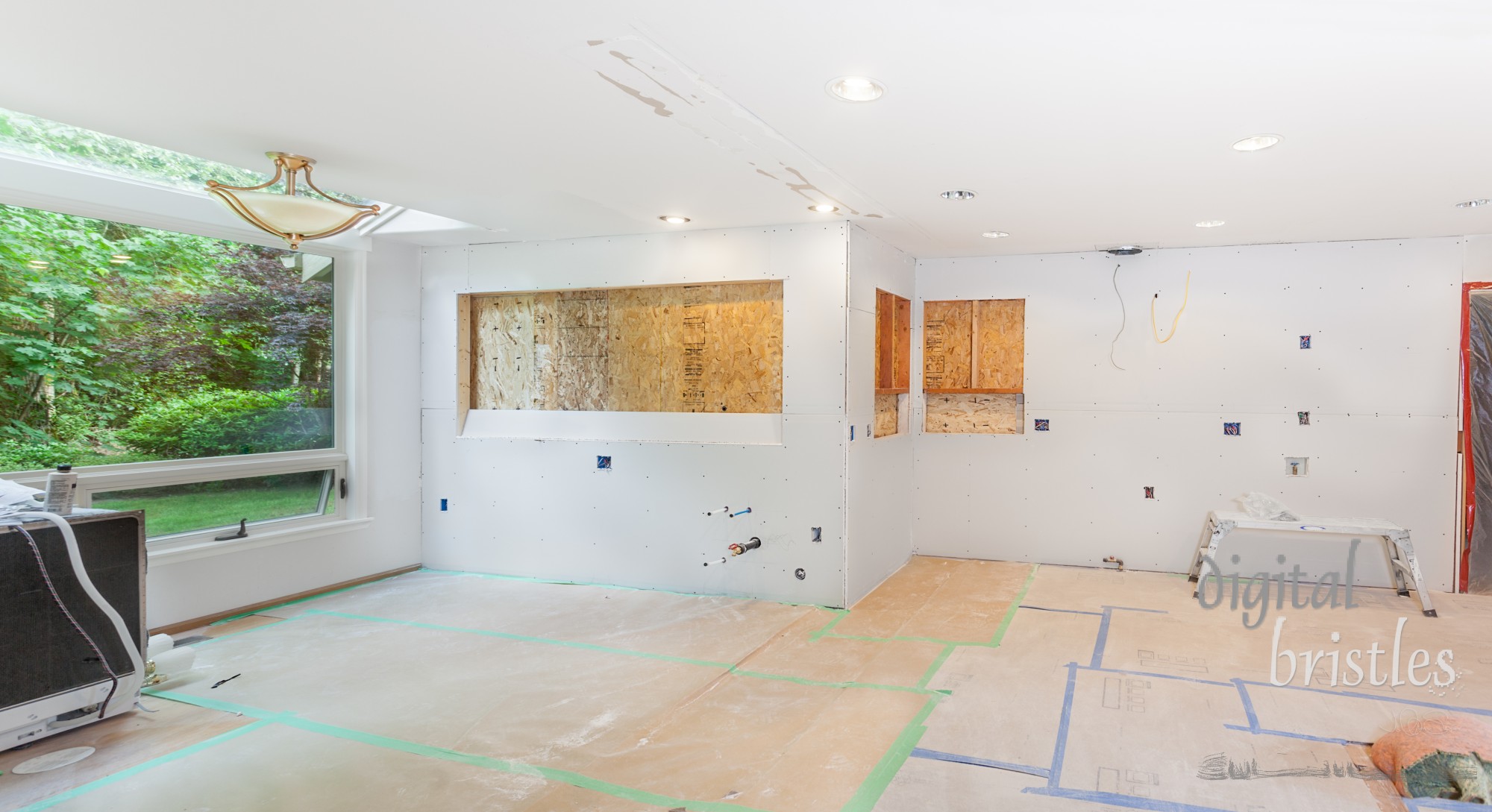 Kitchen drywall hung with plywood covering new window openings