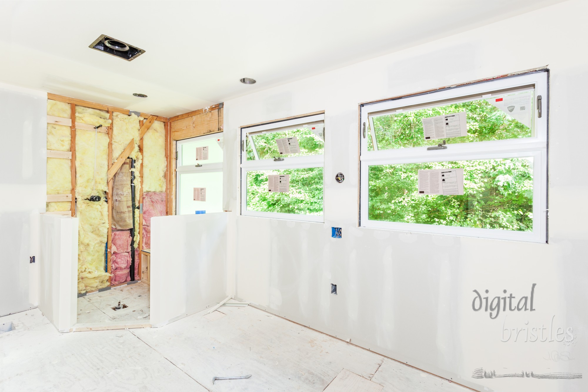 Drywall seams have been taped and smoothed with mud (spackle)