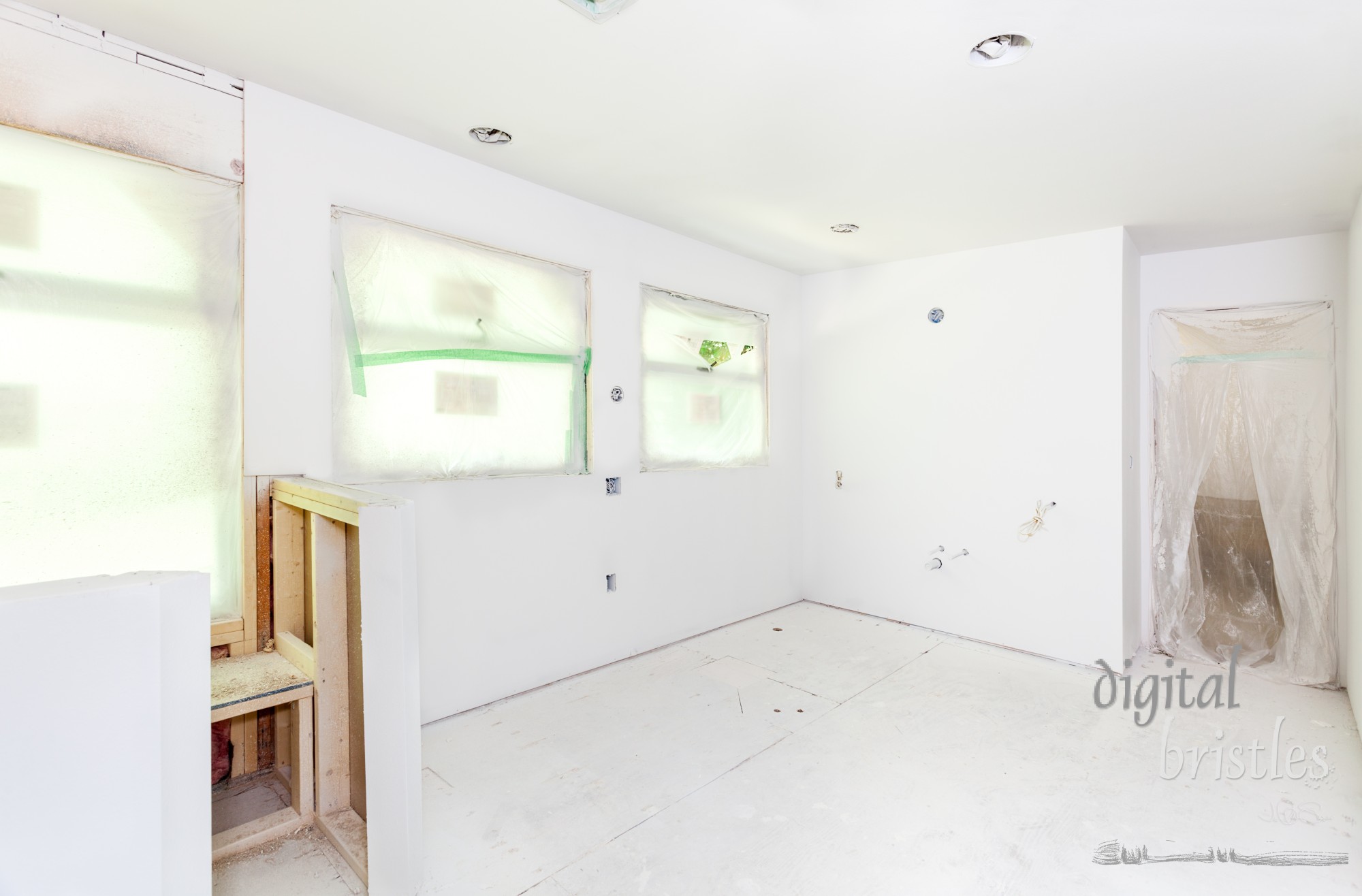 Starting the painting process by priming the textured drywall