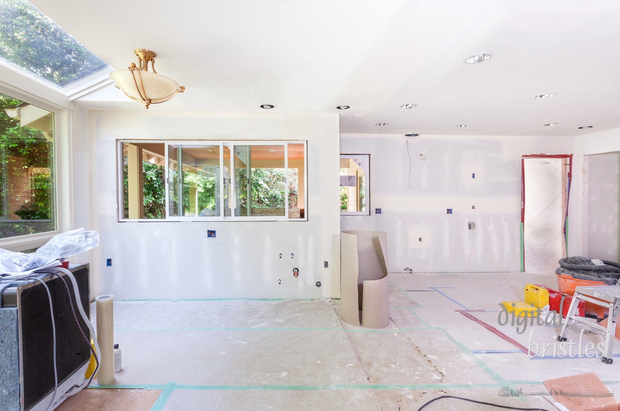 Kitchen windows installed, drywall taped and mud applied to seams