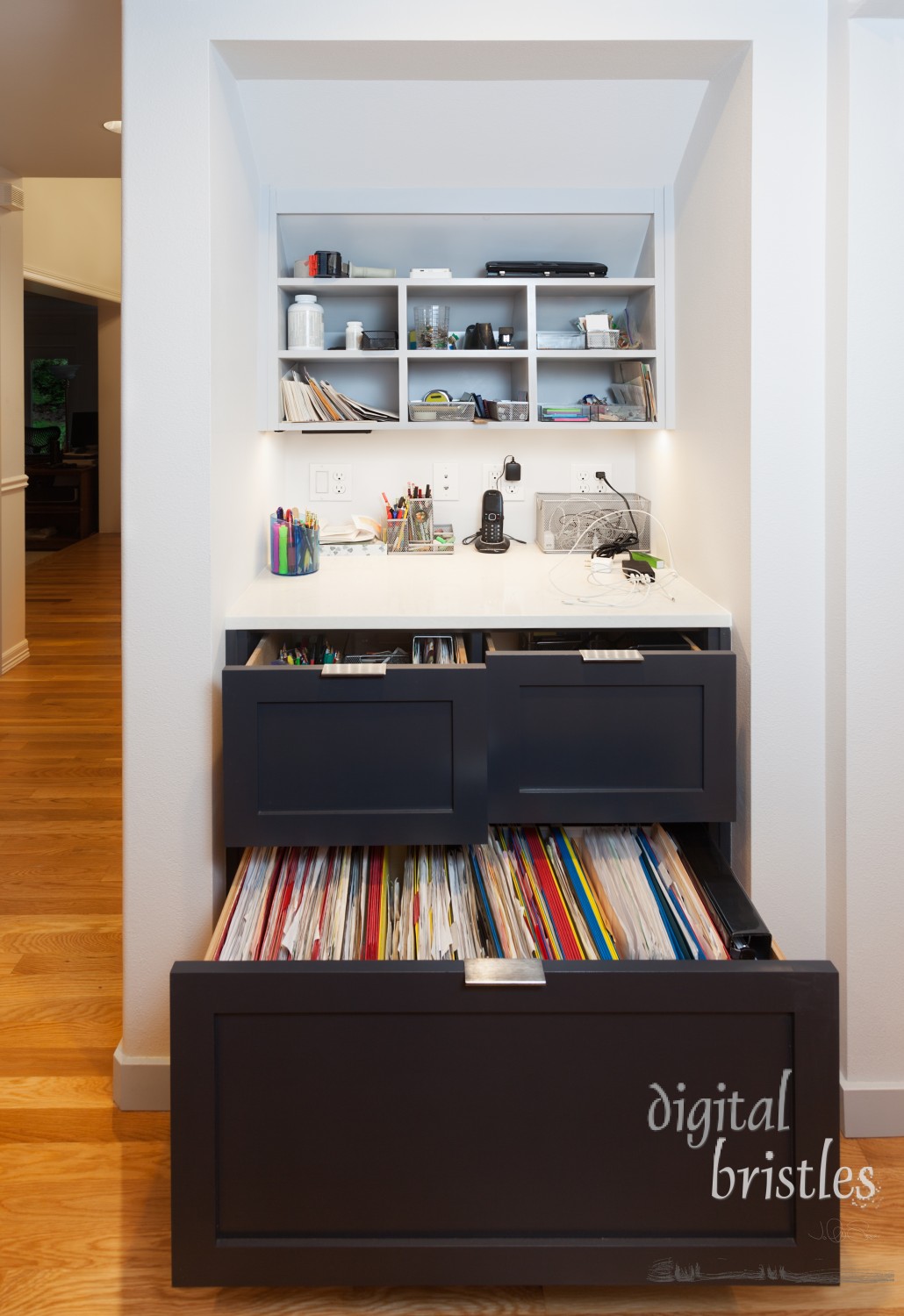 Kitchen desk area with drawers, file cabinet, cubbies and electronics charging station