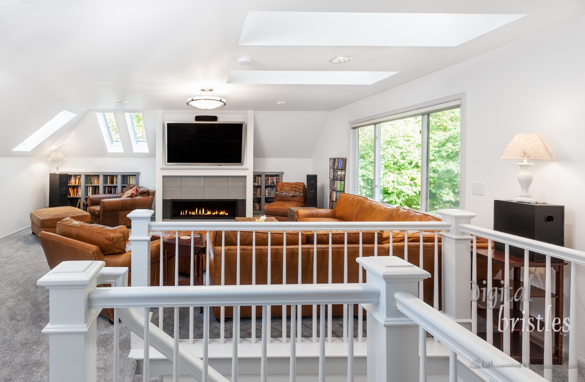 New fireplace, skylights and seating complete the media/reading room