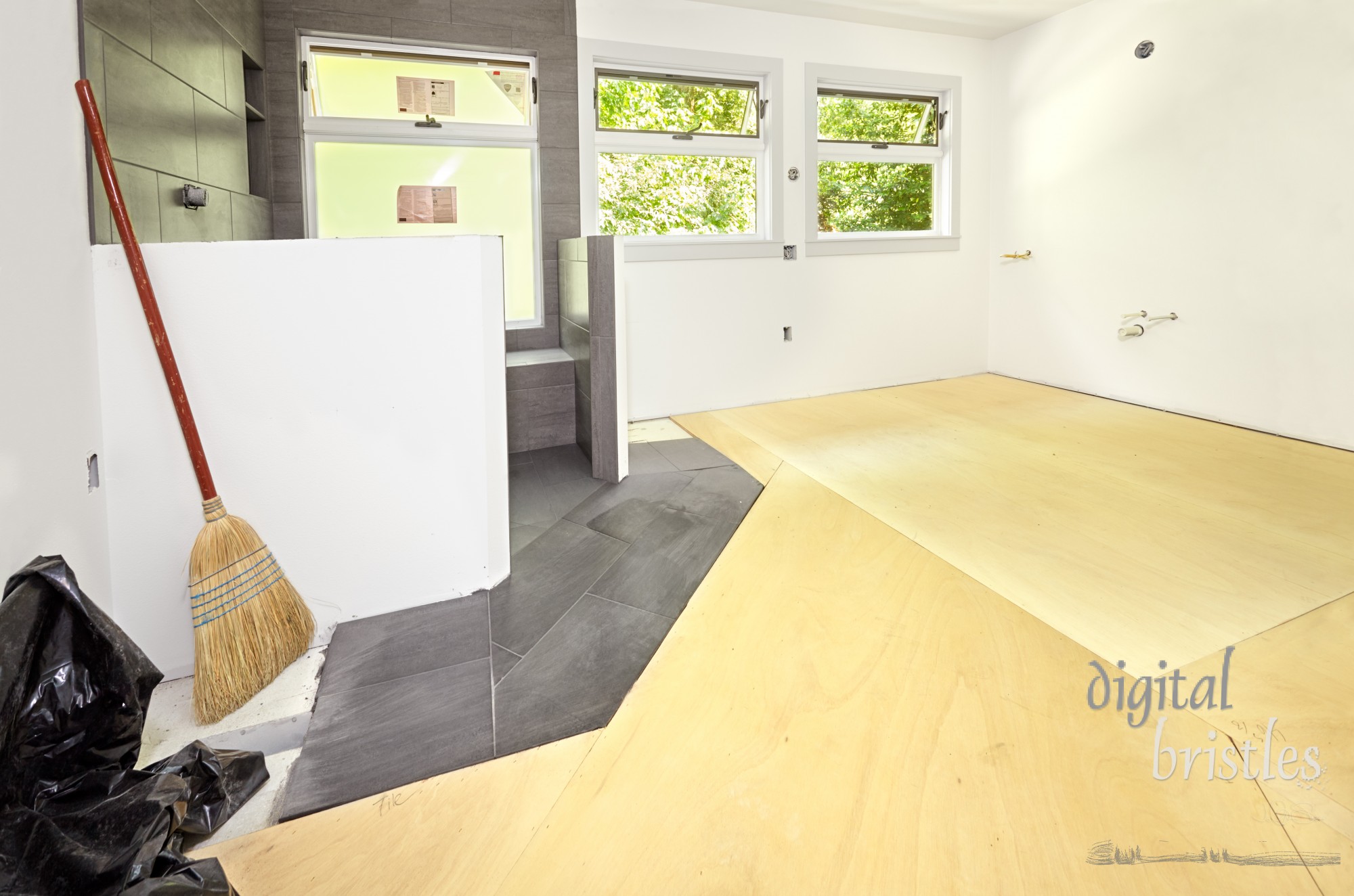 Plywood base over subfloor prior to installing cork tiles