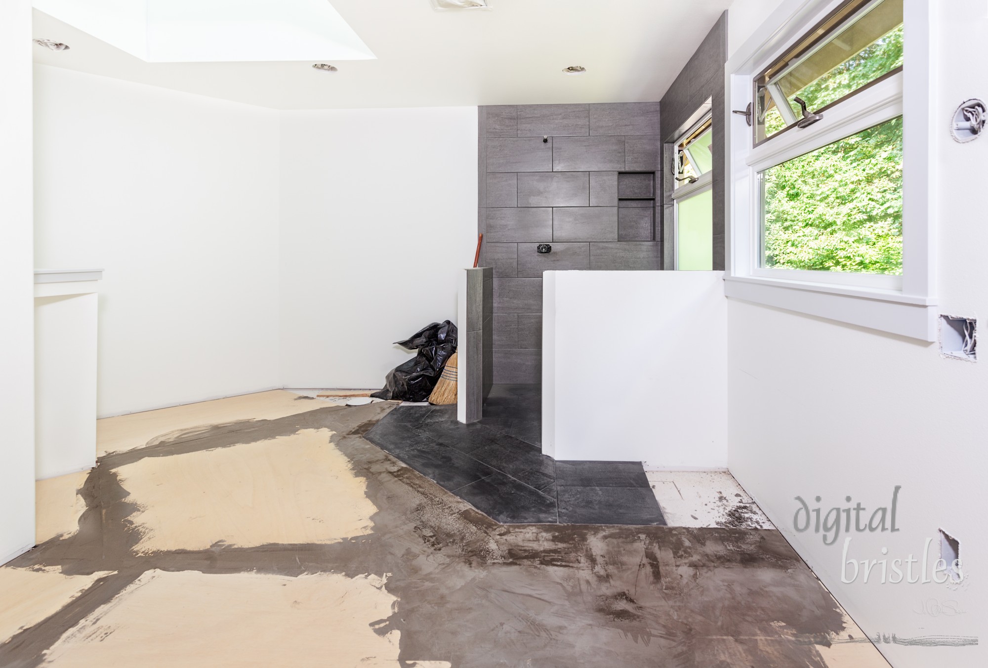 Plywood subfloor, seams covered with floor filler, in preparation for laying cork tiles