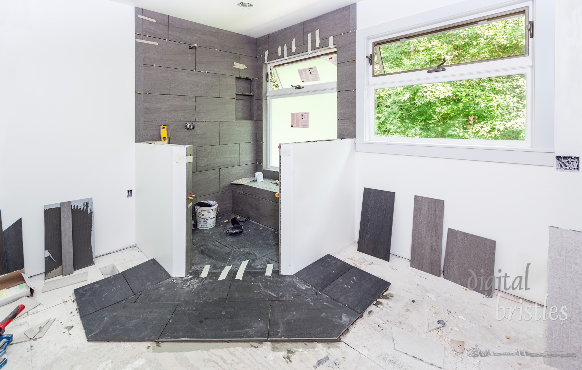 Custom shower stall fully tiled, left with spacers while drying prior to adding grout