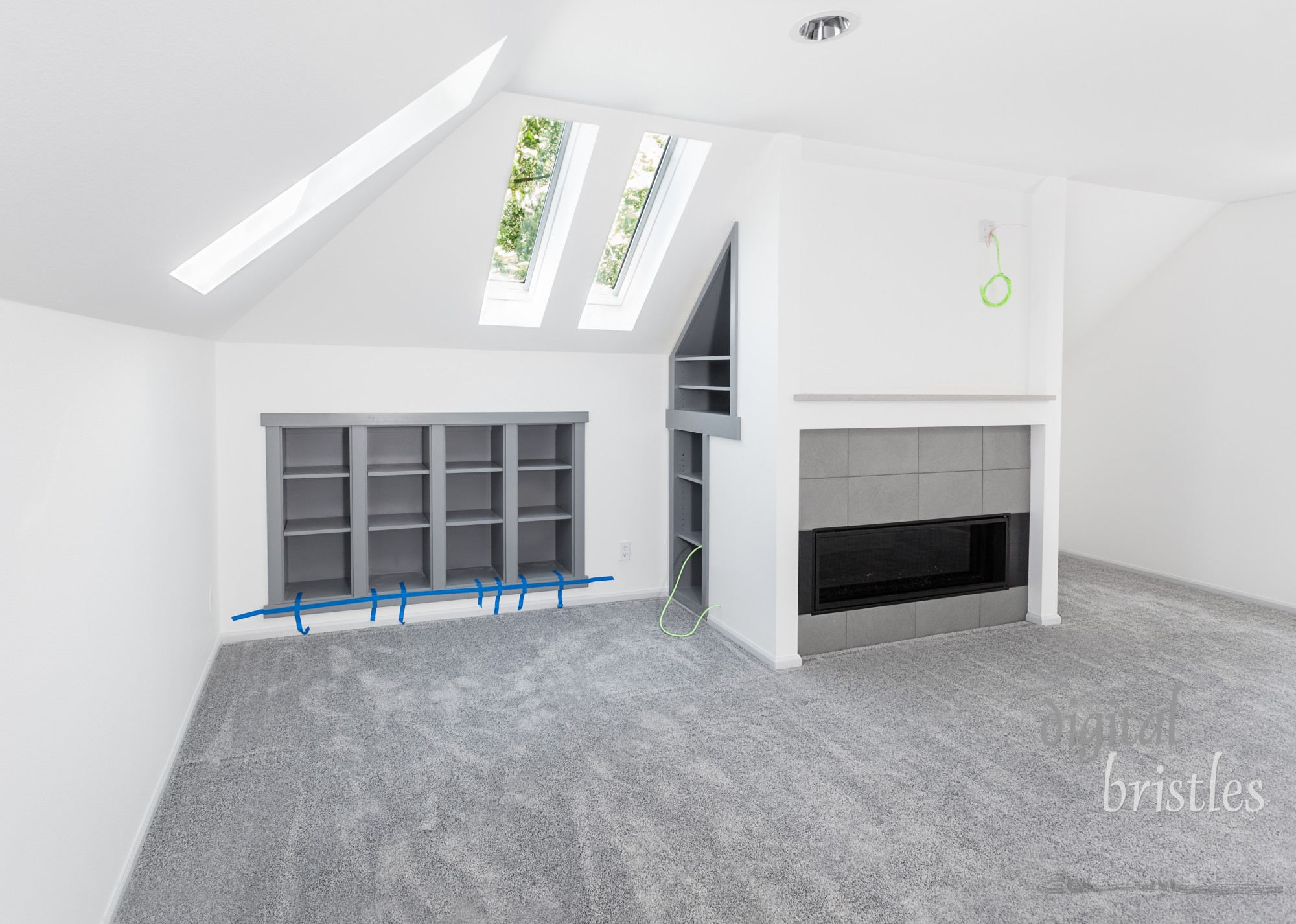 Shelf inserts for books and electronics installed into wall and cavity behind new fireplace