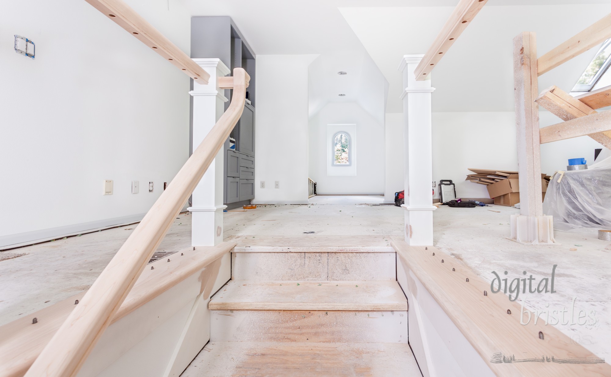 Screw threads in the bottom and holes in the handrail for the balusters at the top of the stairs