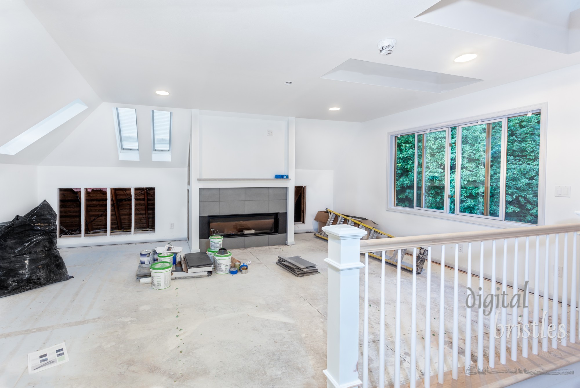 Custom stair rails, balusters and remaining skylights installed