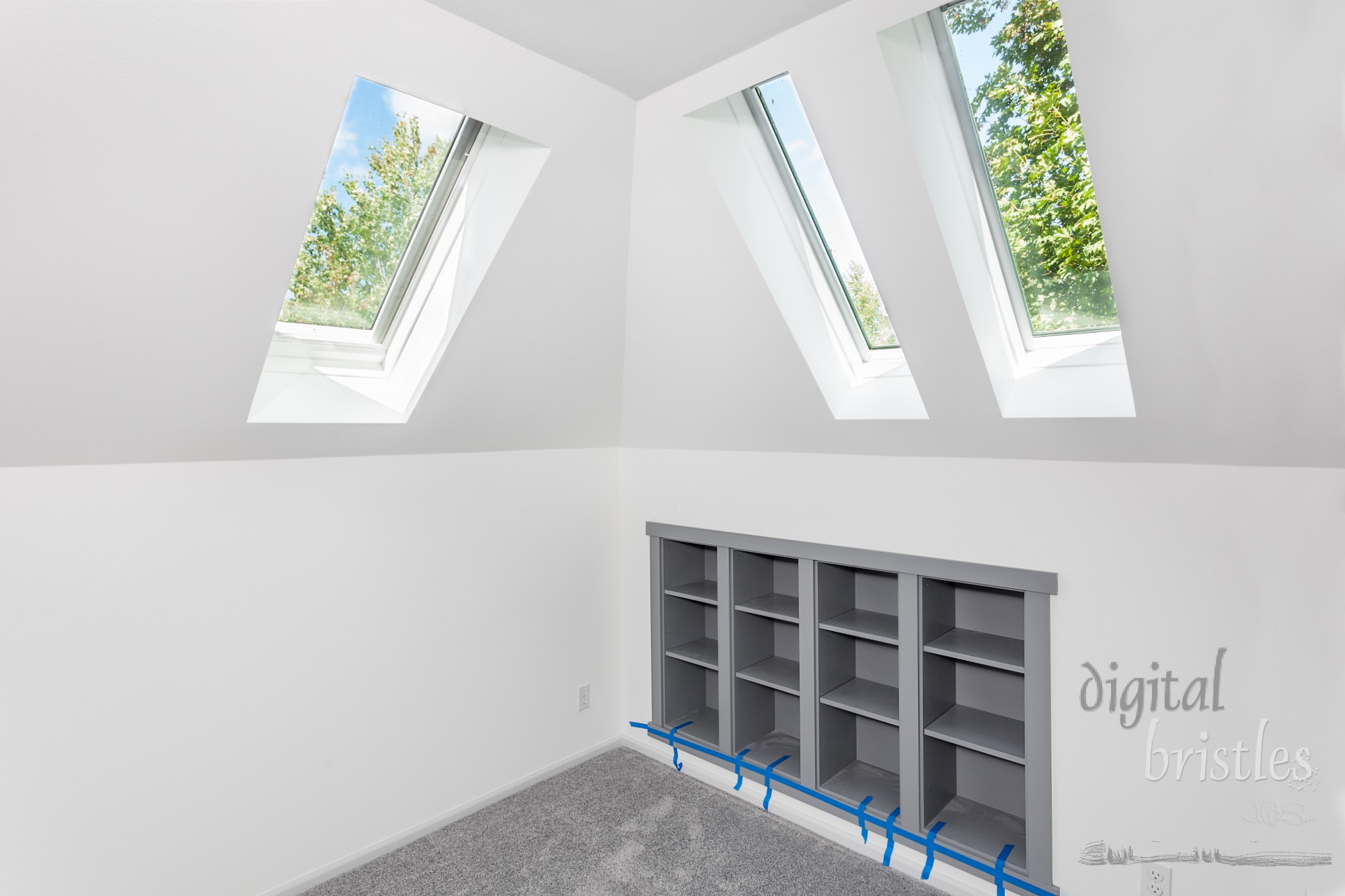 In-wall bookcases and skylights in the reading corner of media room