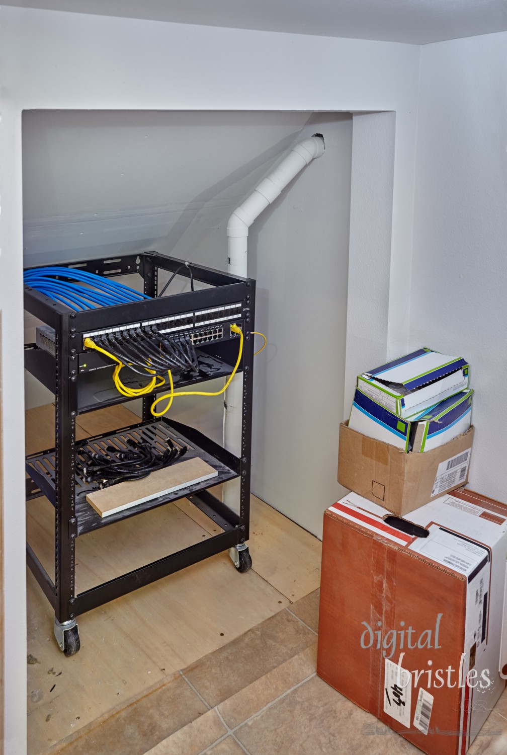 Home run wiring ethernet network closet under the back stairs created during a remodel.