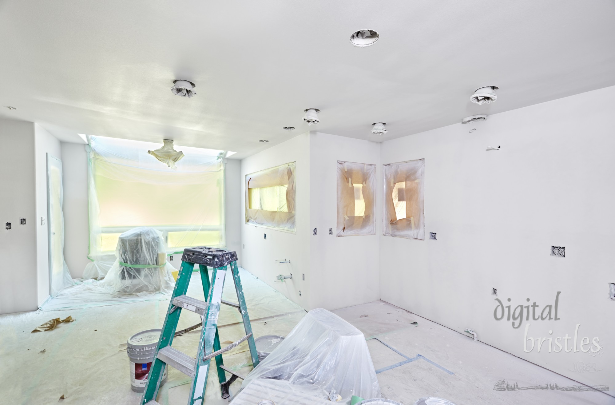 Kitchen wrapped and taped for spray painting the walls and ceiling